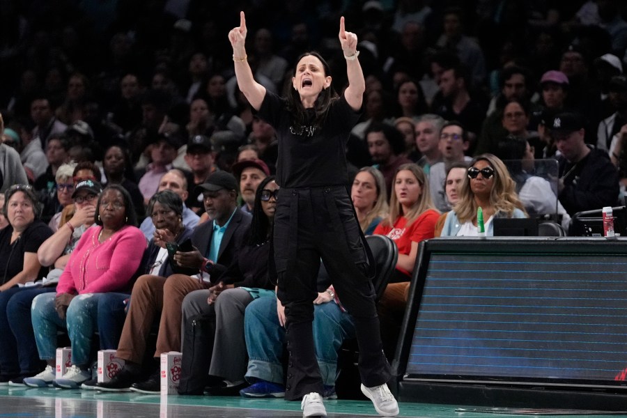 New York Liberty head coach Sandy Brondello calls out to her team during the first half of a WNBA basketball semifinal game against the Las Vegas Aces, Tuesday, Oct. 1, 2024, in New York. (AP Photo/Frank Franklin II)