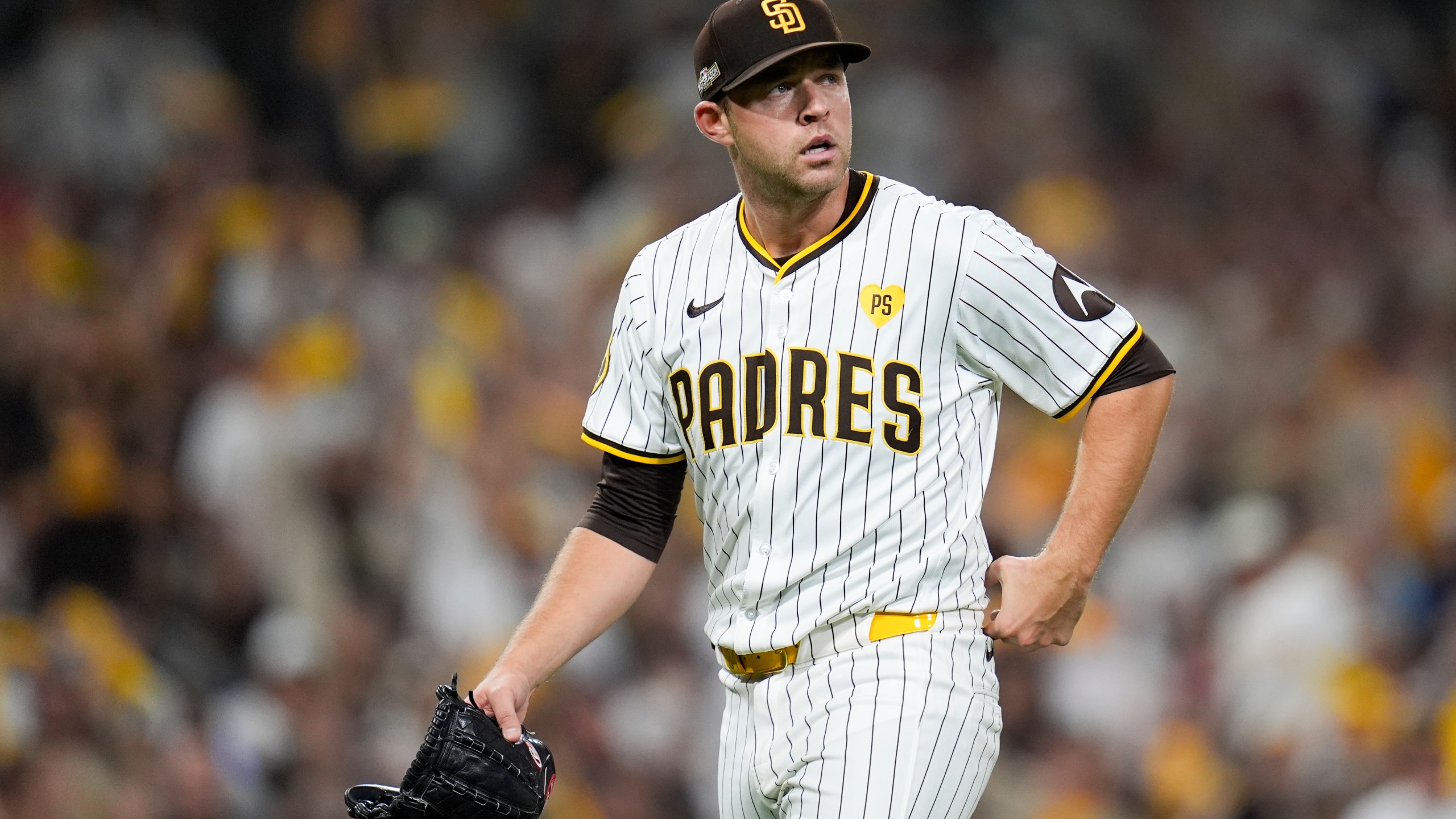 San Diego Padres starting pitcher Michael King walks off the mound after getting the third out during the sixth inning in Game 1 of an NL Wild Card Series baseball game against the Atlanta Braves, Tuesday, Oct. 1, 2024, in San Diego. (AP Photo/Gregory Bull)