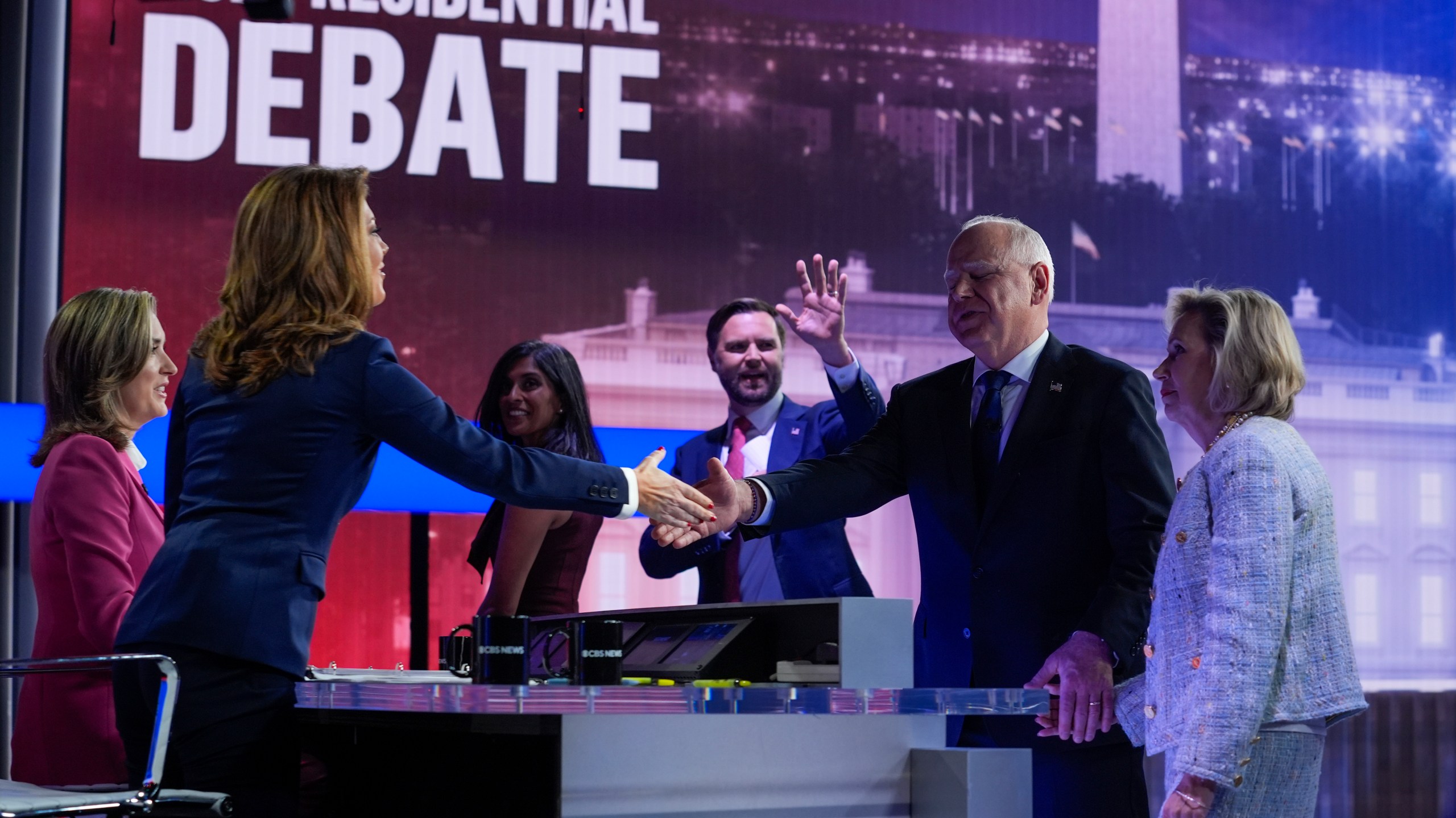 Republican vice presidential nominee Sen. JD Vance, R-Ohio, and his wife Usha Vance leave that stage as Democratic vice presidential candidate Minnesota Gov. Tim Walz and his wife Gwen Walz greet moderators Norah O'Donnell and Margaret Brennan after a vice presidential debate hosted by CBS News, Tuesday, Oct. 1, 2024, in New York. (AP Photo/Matt Rourke)