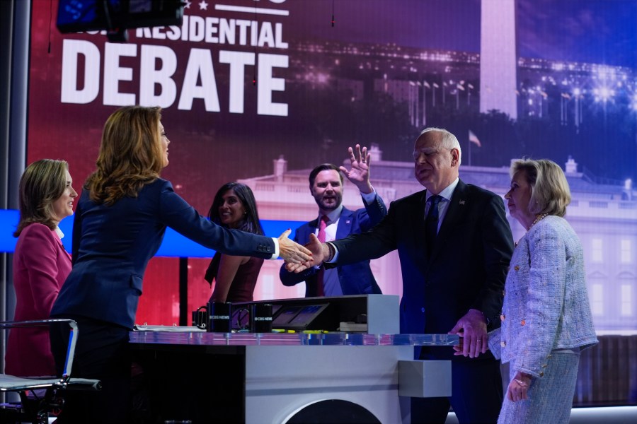 Republican vice presidential nominee Sen. JD Vance, R-Ohio, and his wife Usha Vance leave that stage as Democratic vice presidential candidate Minnesota Gov. Tim Walz and his wife Gwen Walz greet moderators Norah O'Donnell and Margaret Brennan after a vice presidential debate hosted by CBS News, Tuesday, Oct. 1, 2024, in New York. (AP Photo/Matt Rourke)