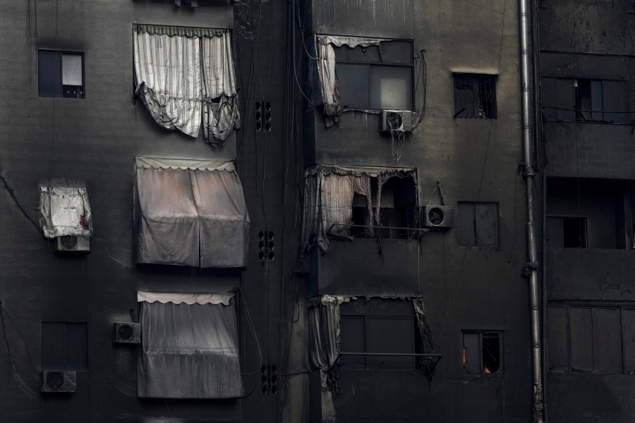 A burnt building shows damage at the site of an Israeli airstrike in Beirut's southern suburb, Lebanon, Tuesday, Oct. 1, 2024. (AP Photo/Hassan Ammar)