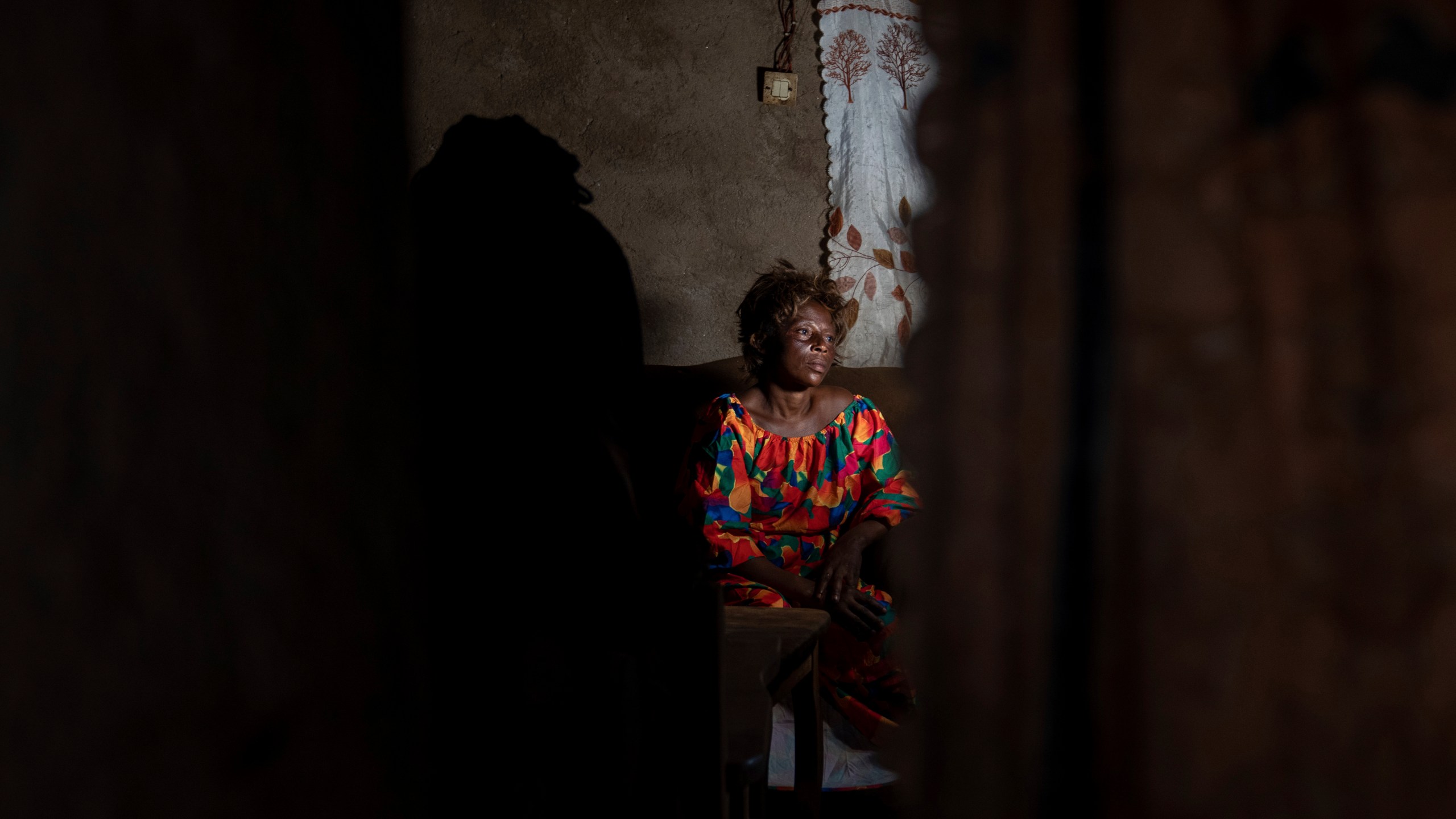 Sifa Kunguja, a 40-year-old sex worker, sits home after recovering from mpox, Wednesday, Sept. 4, 2024, in Kamituga, eastern Congo. (AP Photo/Moses Sawasawa)