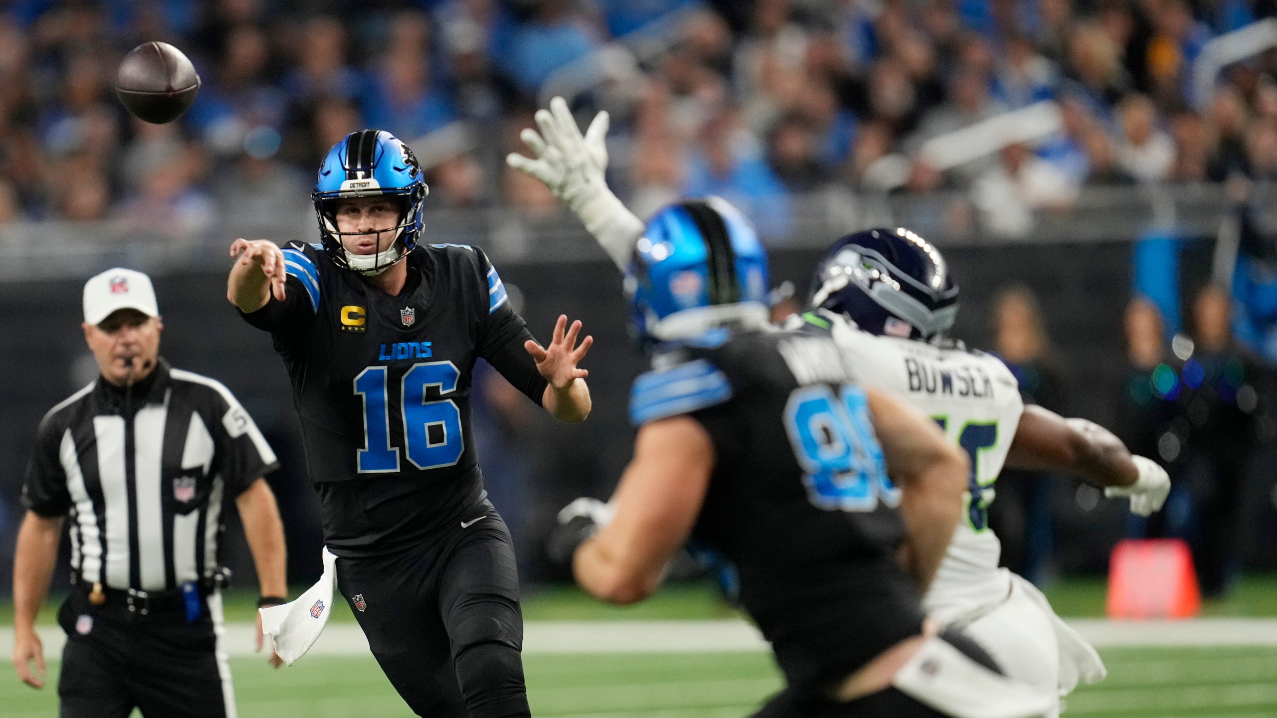 Detroit Lions quarterback Jared Goff (16) passes during the first half of an NFL football game against the Seattle Seahawks, Monday, Sept. 30, 2024, in Detroit. (AP Photo/Paul Sancya)