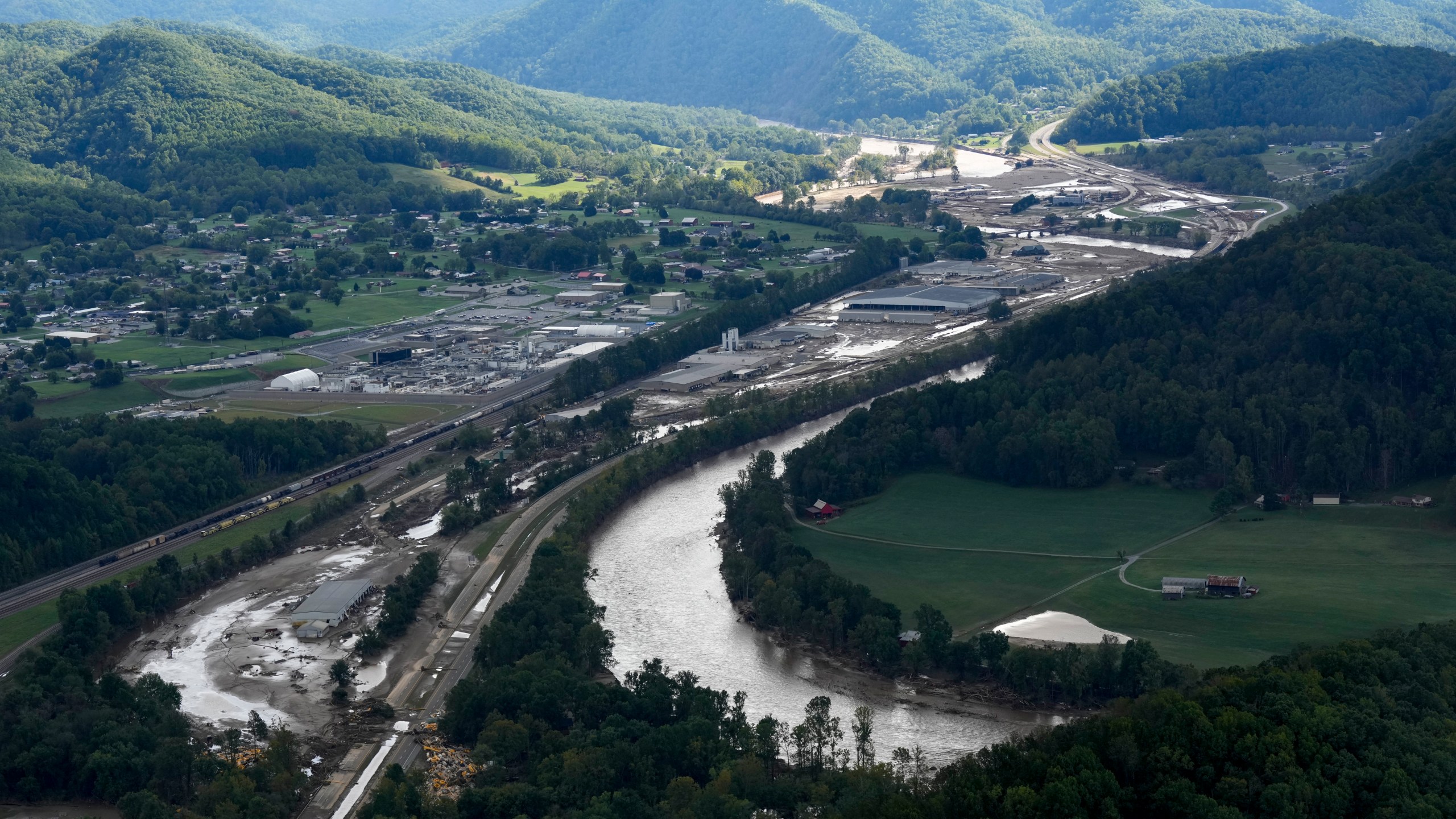 An aerial view of flood damage in the aftermath of Hurricane Helene, Saturday, Sept. 28, 2024, in Erwin, Tenn. (AP Photo/George Walker IV)