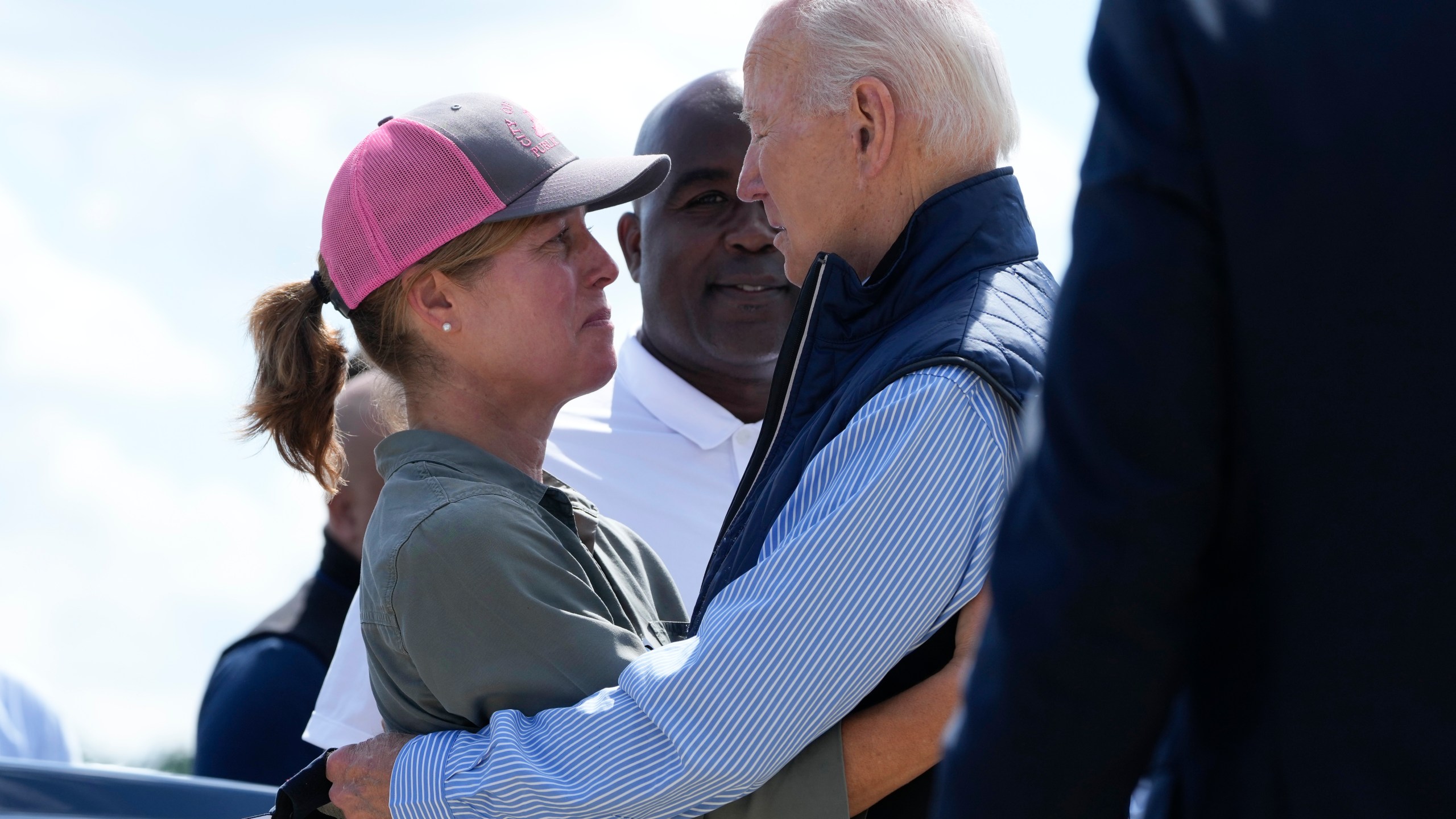 President Joe Biden talks with Asheville Mayor Esther Manheimer, as he arrives at Greenville-Spartanburg International Airport in Greer, S.C., Wednesday, Oct. 2, 2024, to survey damage from Hurricane Helene. (AP Photo/Susan Walsh)