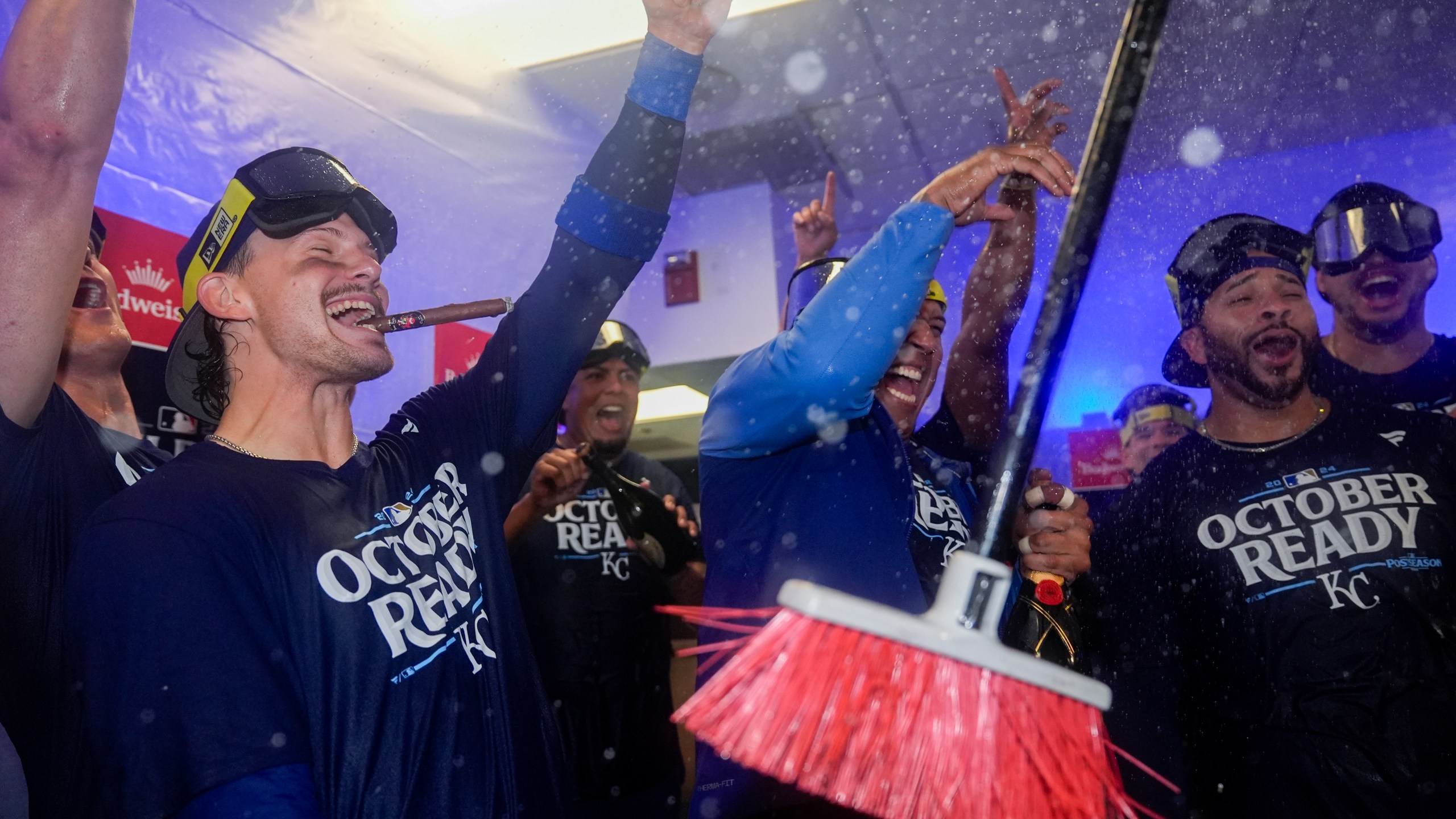 Kansas City Royals shortstop Bobby Witt Jr., left, catcher Salvador Perez, center, and outfielder Tommy Pham, right, celebrate with teammates after defeating the Baltimore Orioles 2-1 in Game 2 of an AL Wild Card Series baseball game, Wednesday, Oct. 2, 2024 in Baltimore. (AP Photo/Stephanie Scarbrough)