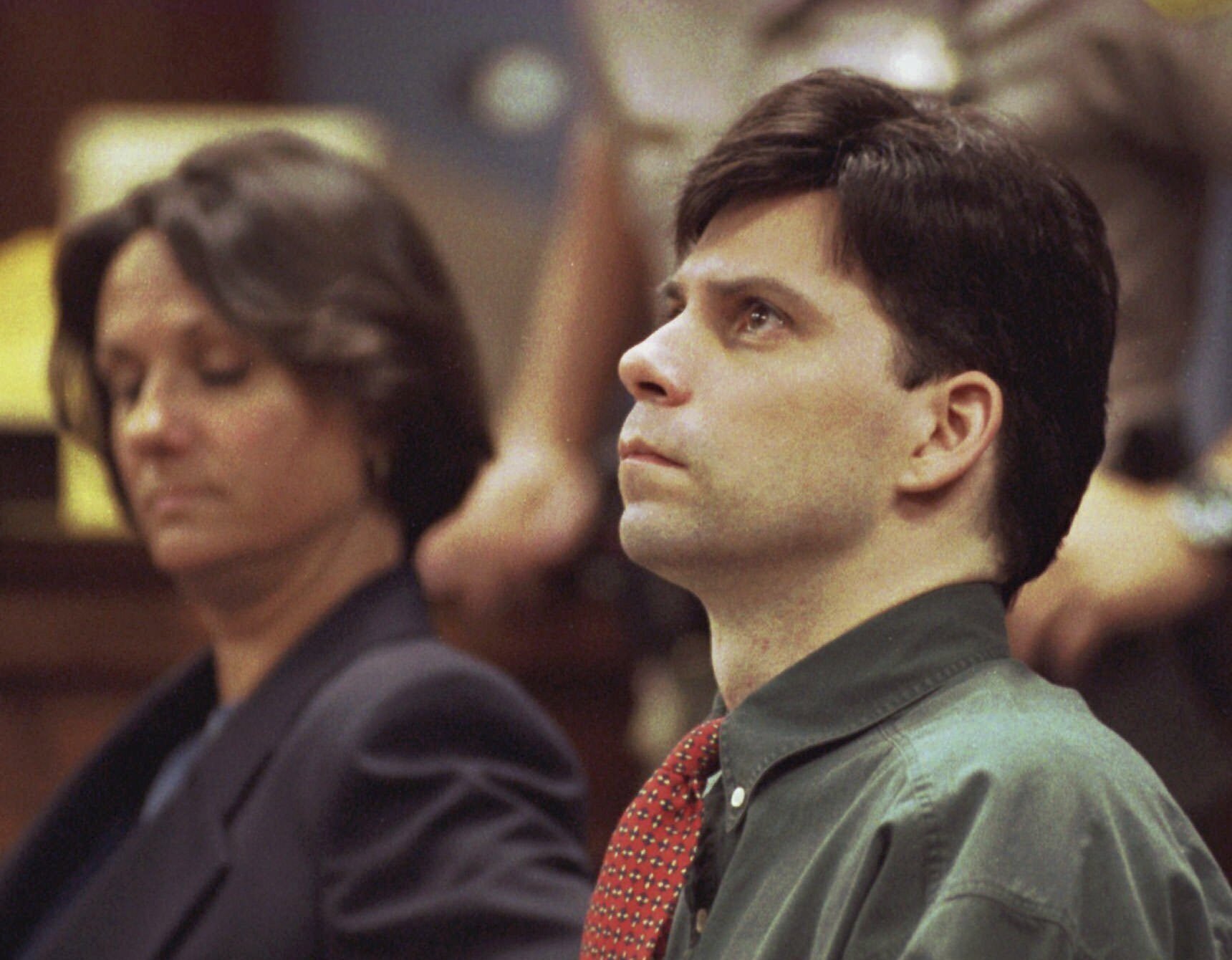 FILE - Lyle Menendez looks up during testimony in his and brother Erik's retrial for the shotgun slayings of their parents, Oct. 20, 1995 in Los Angeles. (Steve Grayson/Pool Photo via AP, File)