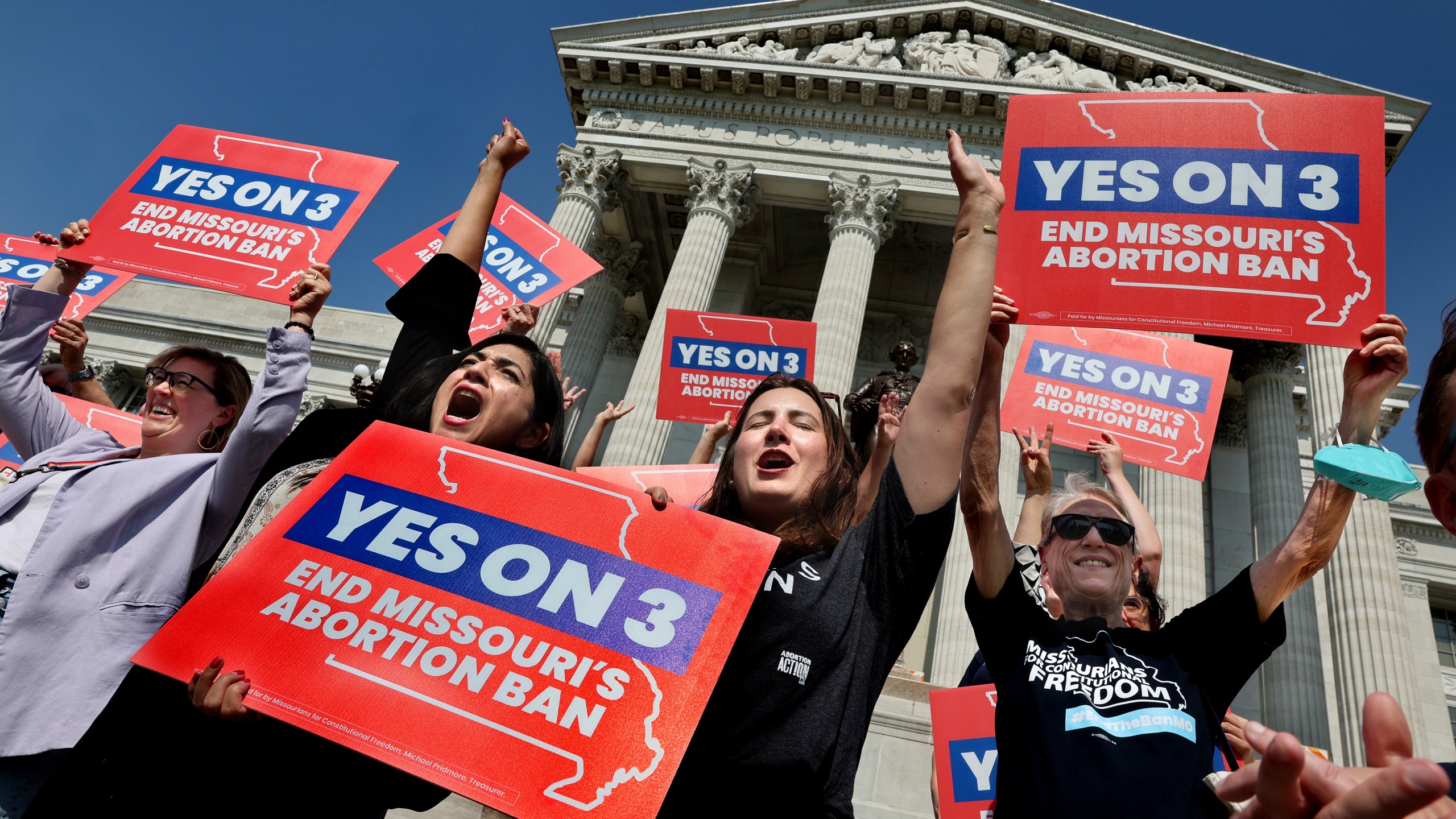 Amendment 3 supporters Luz Maria Henriquez, second from left, executive director of the ACLU Missouri, celebrates with Mallory Schwarz, center, of Abortion Action Missouri, after the Missouri Supreme Court in Jefferson City, Mo., ruled that the amendment to protect abortion rights would stay on the November ballot in on Tuesday, Sept. 10, 2024. (Robert Cohen/St. Louis Post-Dispatch via AP)