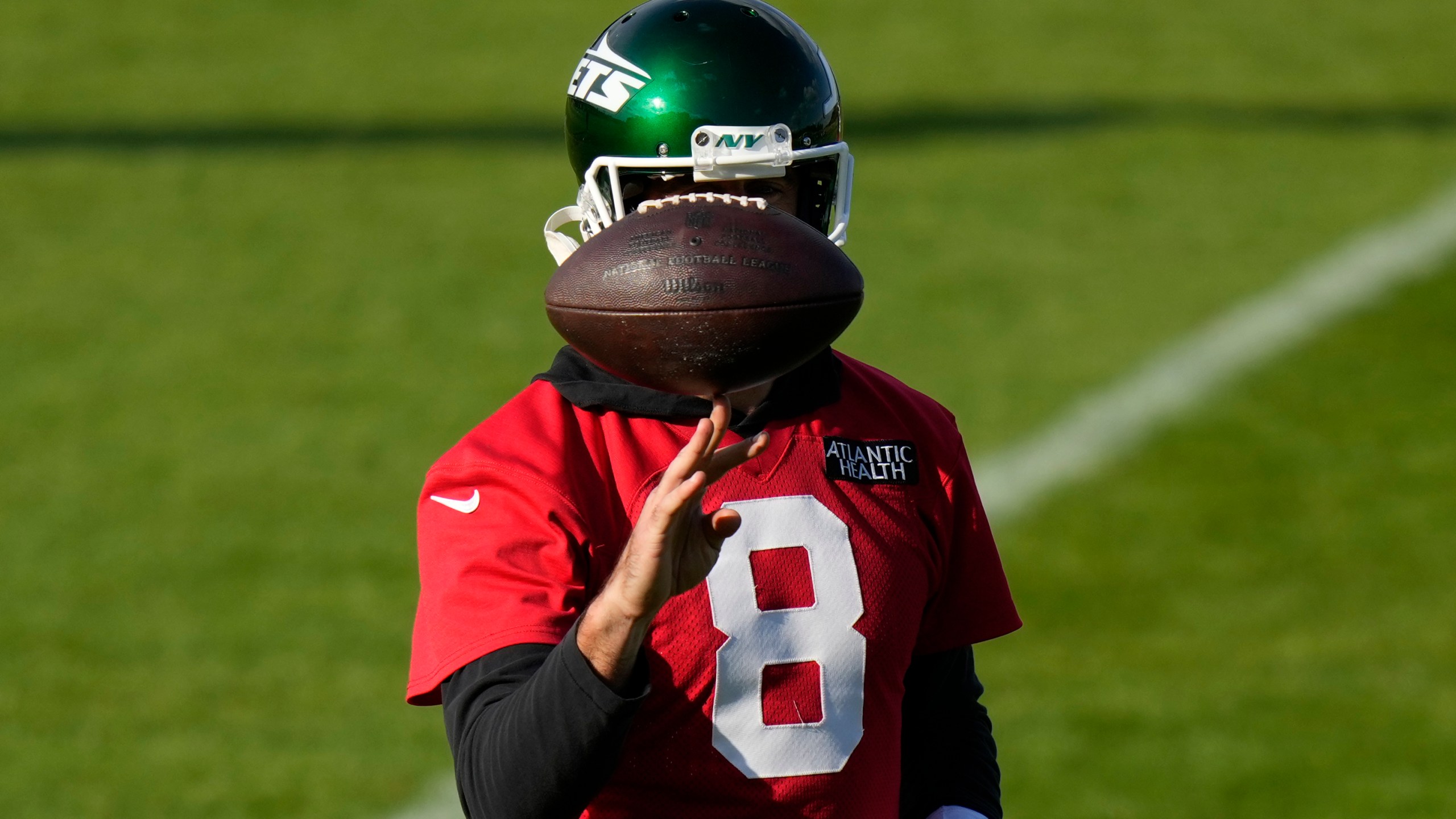 New York Jets quarterback Aaron Rodgers (8) participates in a training session in Ware, England, Friday, Oct. 4, 2024, ahead of the game between New York Jets and Minnesota Vikings at the Tottenham Hotspur stadium on Sunday. (AP Photo/Alastair Grant)