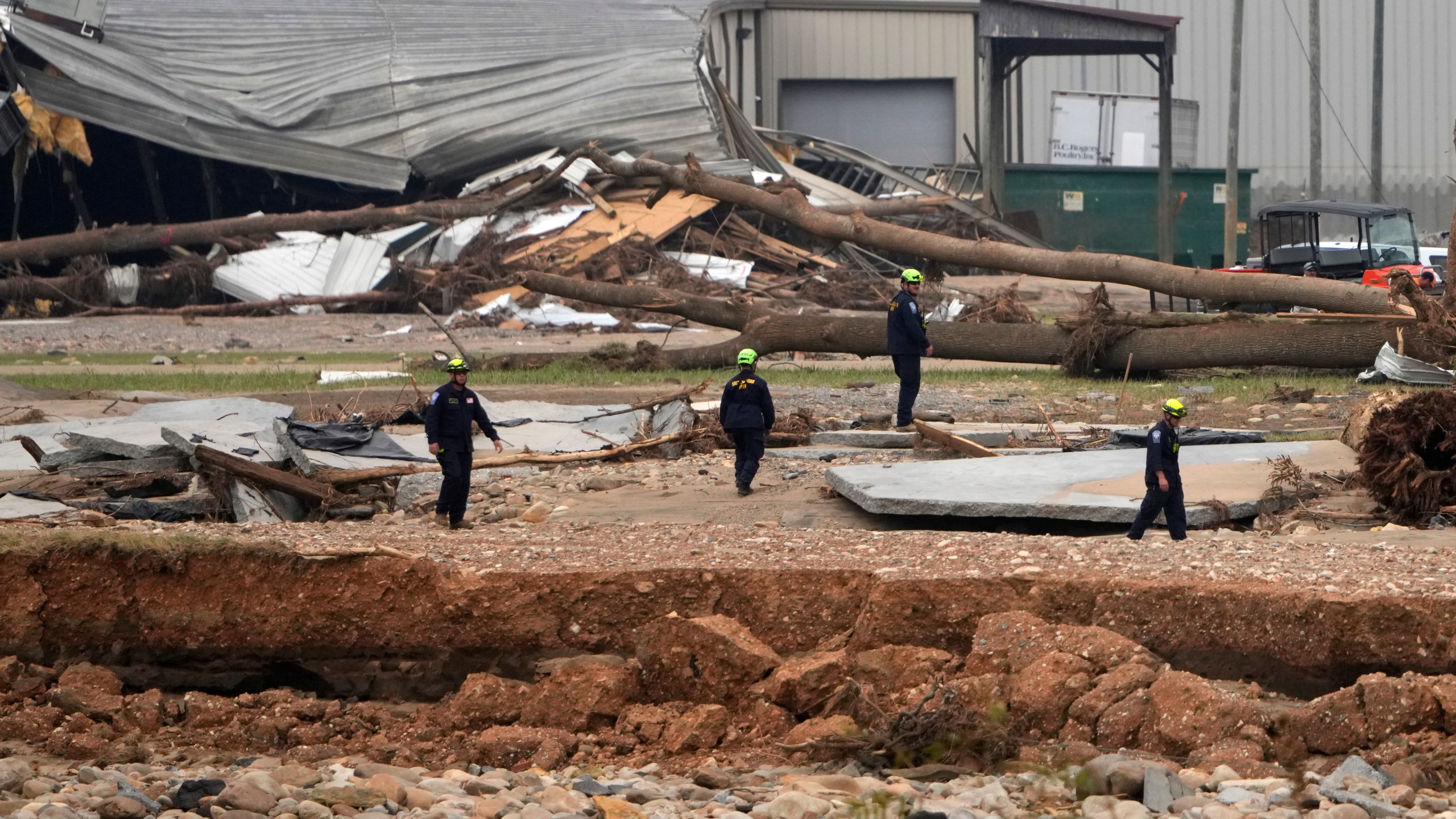 Personnel from Urban Search and Rescue Utah Task Force 1 work in the aftermath of Hurricane Helene Friday, Oct. 4, 2024, in Erwin, Tenn. (AP Photo/Jeff Roberson)