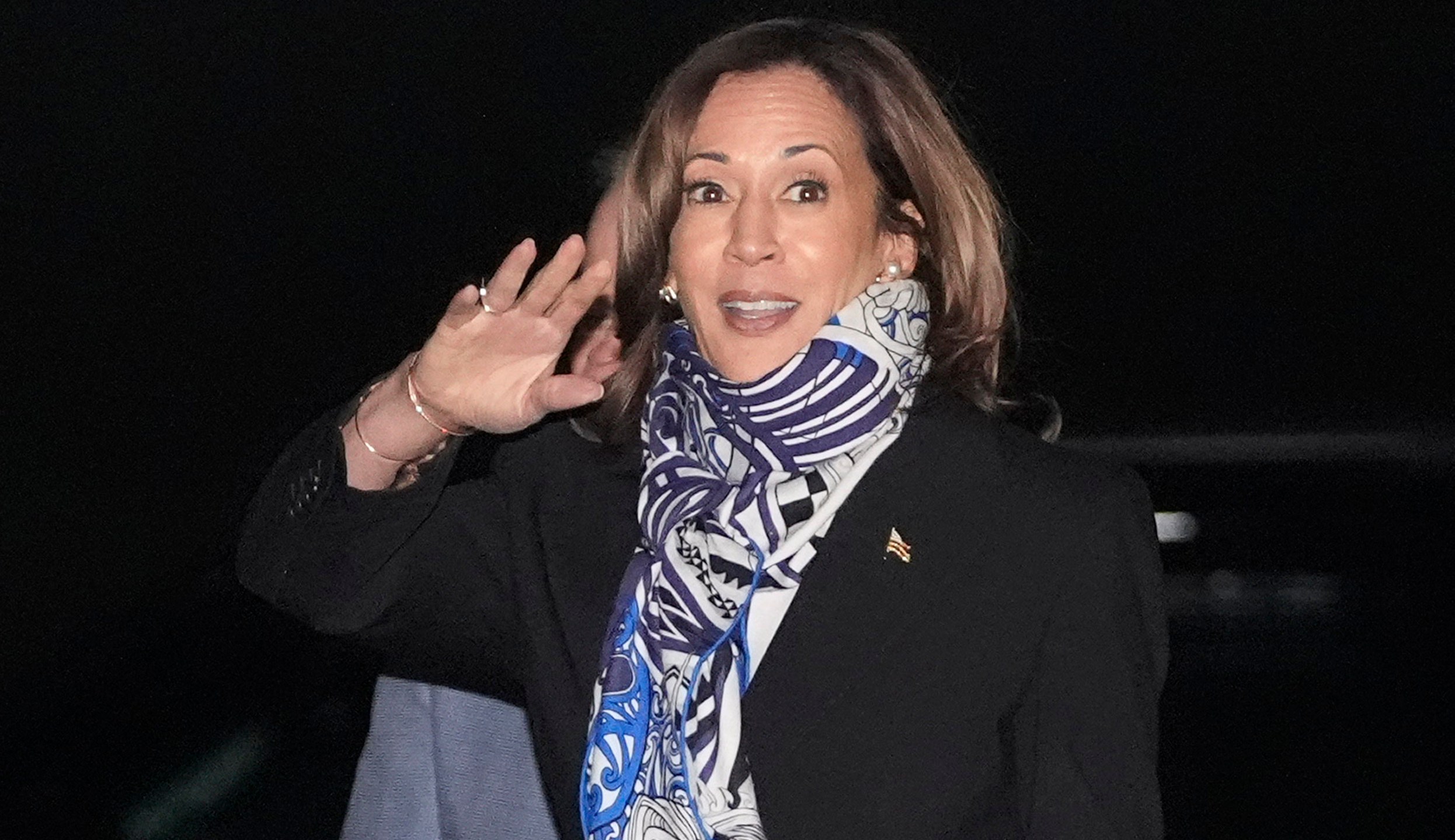 Democratic presidential nominee Vice President Kamala Harris waves as she arrives on Air Force Two at Detroit Metropolitan Wayne County Airport in Romulus, Mich., Thursday, Oct. 3, 2024. (AP Photo/Mark Schiefelbein)