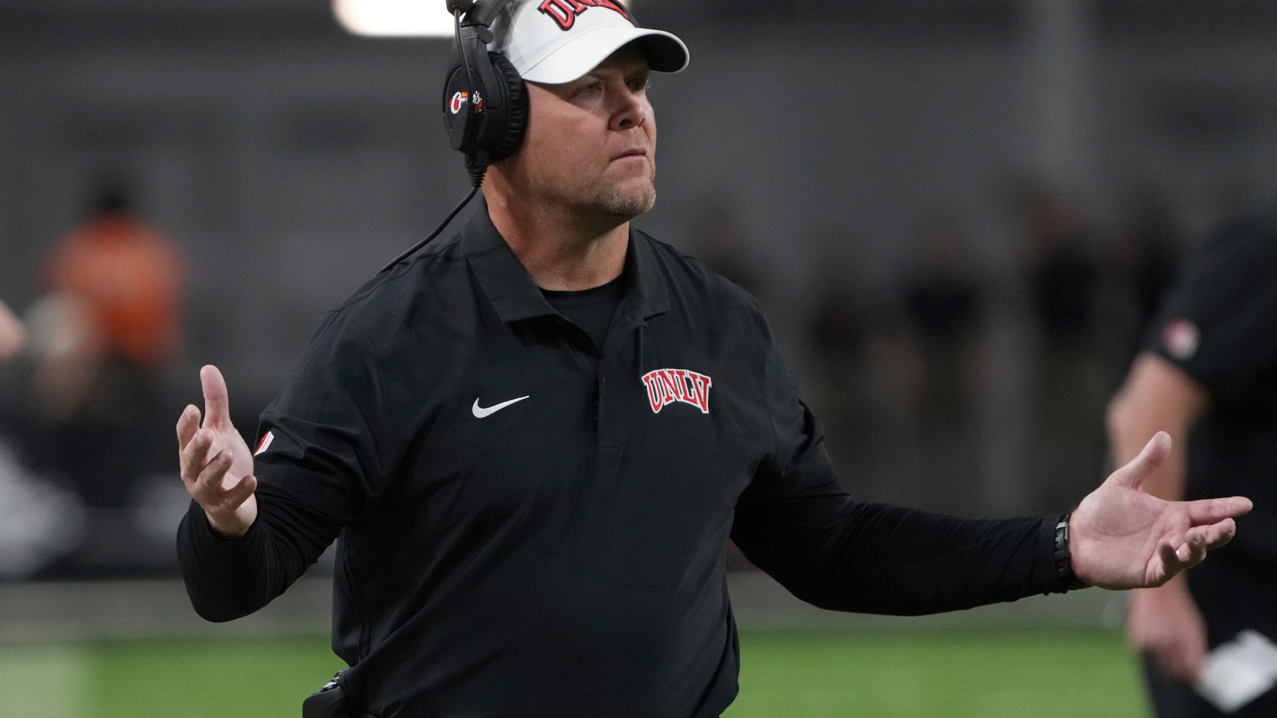 UNLV head coach Barry Odom reacts to a holding foul in the first half during an NCAA college football game against Syracuse, Friday, Oct. 4, 2024, in Las Vegas. (AP Photo/Rick Scuteri)