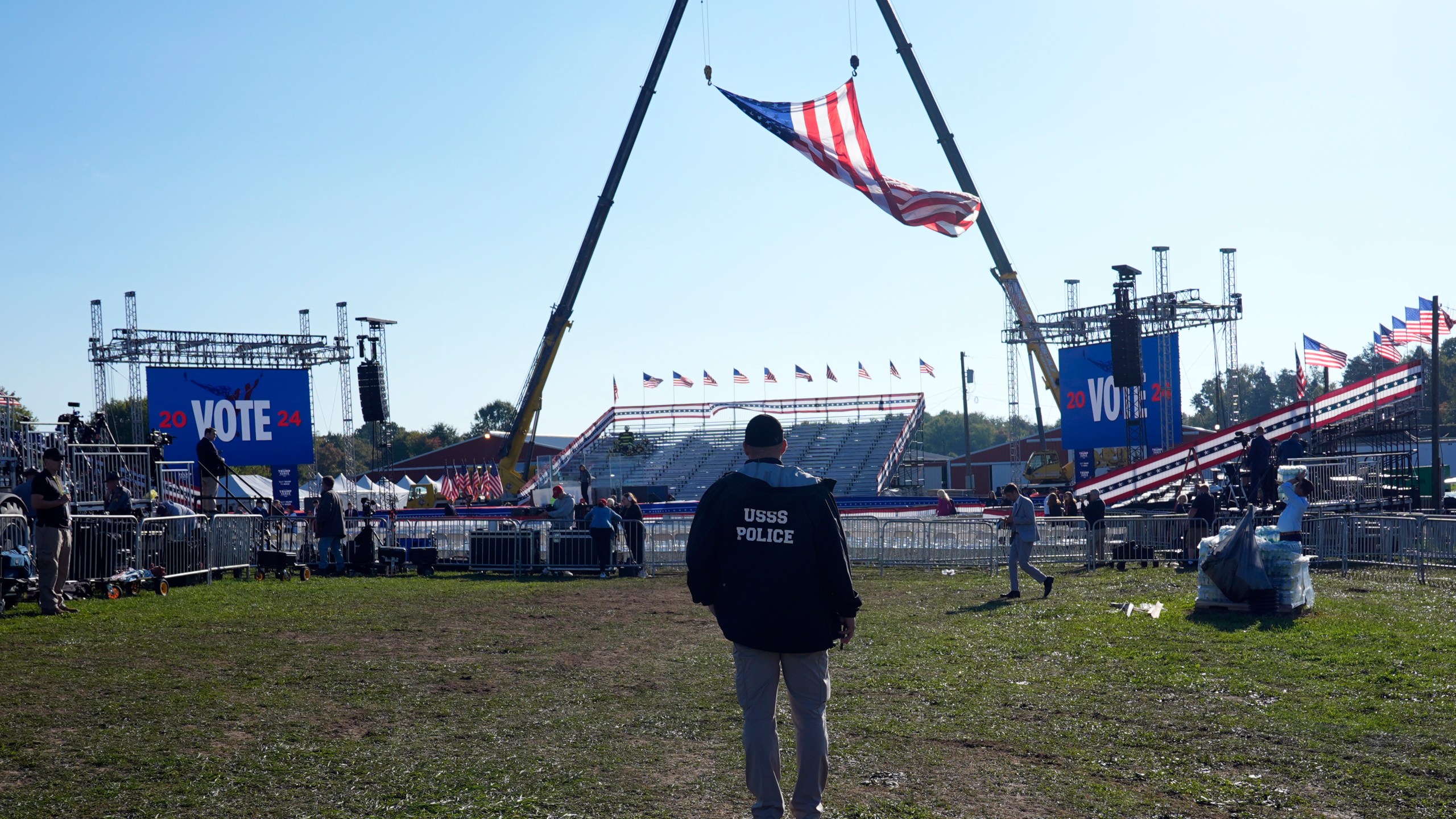 A U.S. Secret Service agent looks at the site before Republican presidential nominee former President Donald Trump speaks at a campaign rally at the Butler Farm Show, the site where a gunman tried to assassinate him in July, Saturday, Oct. 5, 2024, in Butler, Pa. (AP Photo/Alex Brandon)