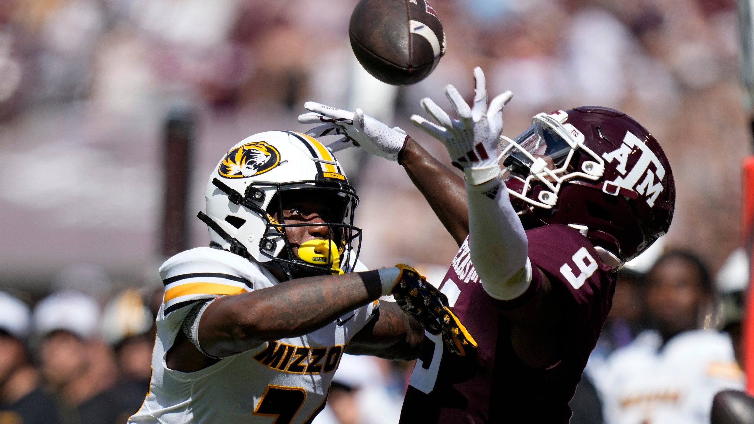 Missouri cornerback Nicholas Deloach Jr. (24) breaks up a pass intended for Texas A&M wide receiver Jahdae Walker (9) during the first half of an NCAA college football game Saturday, Oct. 5, 2024, in College Station, Texas. (AP Photo/Eric Gay)