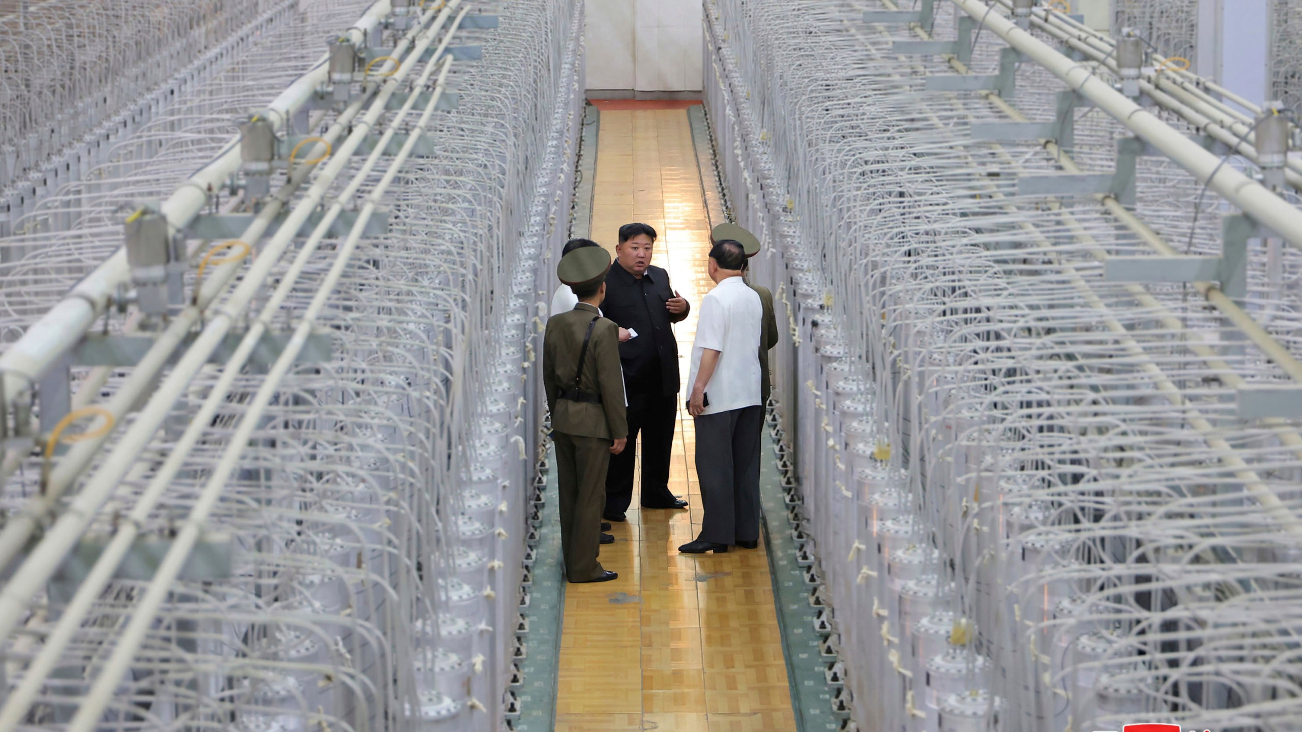 FILE - This undated photo provided on Sept. 13, 2024, by the North Korean government shows its leader Kim Jong Un, center, on an inspecting visit at what they say is an institute of nuclear weapons and a facility for nuclear materials at an undisclosed location in North Korea. Independent journalists were not given access to cover the event depicted in this image distributed by the North Korean government. The content of this image is as provided and cannot be independently verified. Korean language watermark on image as provided by source reads: "KCNA" which is the abbreviation for Korean Central News Agency. (Korean Central News Agency/Korea News Service via AP, File)