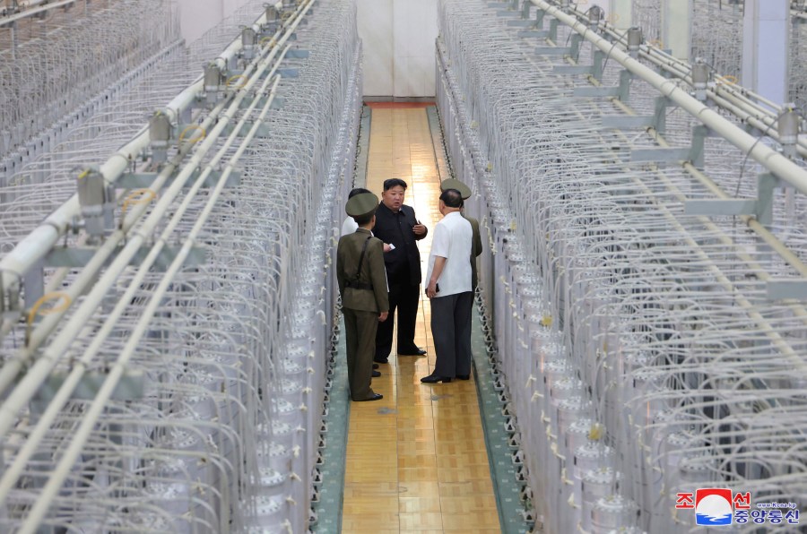 FILE - This undated photo provided on Sept. 13, 2024, by the North Korean government shows its leader Kim Jong Un, center, on an inspecting visit at what they say is an institute of nuclear weapons and a facility for nuclear materials at an undisclosed location in North Korea. Independent journalists were not given access to cover the event depicted in this image distributed by the North Korean government. The content of this image is as provided and cannot be independently verified. Korean language watermark on image as provided by source reads: "KCNA" which is the abbreviation for Korean Central News Agency. (Korean Central News Agency/Korea News Service via AP, File)