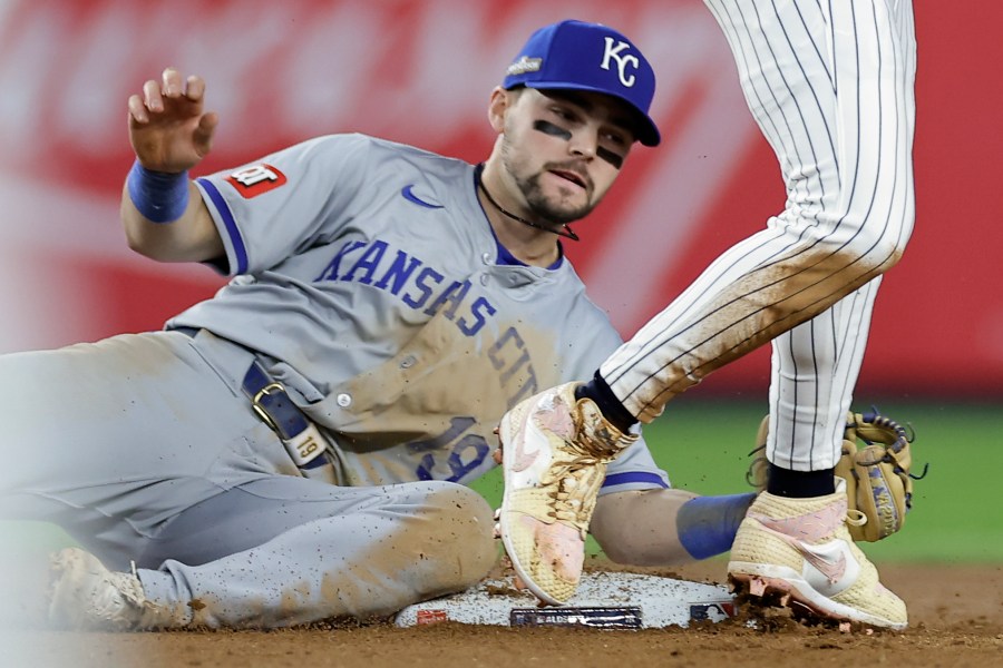 Kansas City Royals second base Michael Massey (19) can't make the tag on New York Yankees' Jazz Chisholm Jr. who stole second base during the seventh inning of Game 1 of the American League baseball division series, Saturday, Oct. 5, 2024, in New York. (AP Photo/Adam Hunger)