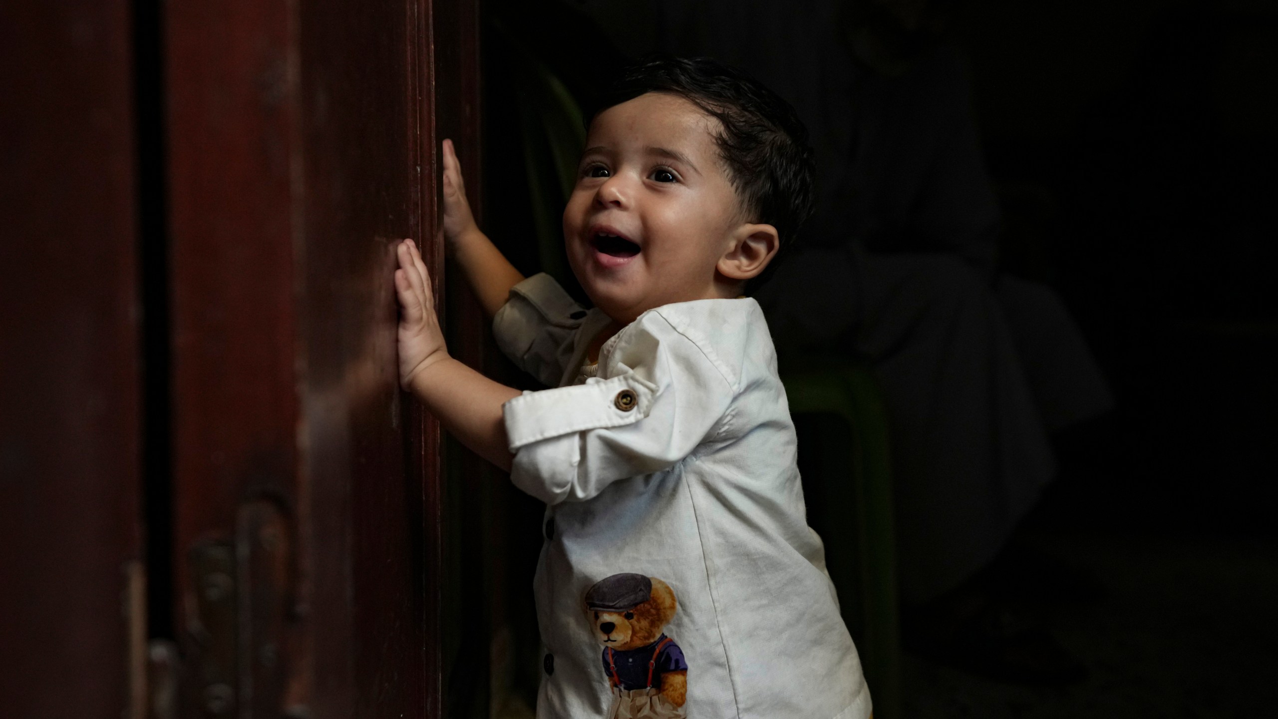 Palestinian child Ali Al-Taweel, who was born on October 7, poses for a picture at his family home in Nuseirat, as the Israeli-Hamas war marks its one year anniversary, Gaza Strip, Saturday, Oct. 5, 2024. (AP Photo/Abdel Kareem Hana)