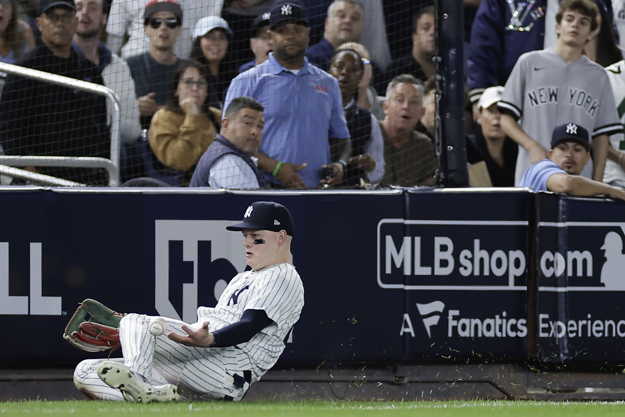 New York Yankees outfielder Alex Verdugo (24) comes up with the catch on a fly ball hit by Kansas City Royals' Michael Massey to end the fourth inning during Game 1 of the American League baseball division series, Saturday, Oct. 5, 2024, in New York. (AP Photo/Adam Hunger)