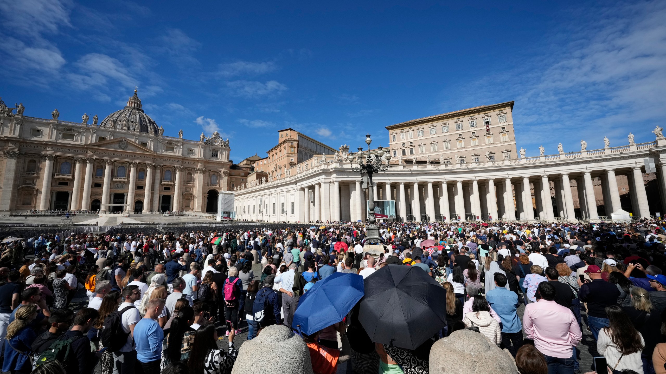 Pope Francis appears at his studio window for the traditional noon blessing of faithful and pilgrims gathered in St. Peter's Square at The Vatican, Sunday, Oct. 6, 2024. (AP Photo/Andrew Medichini)