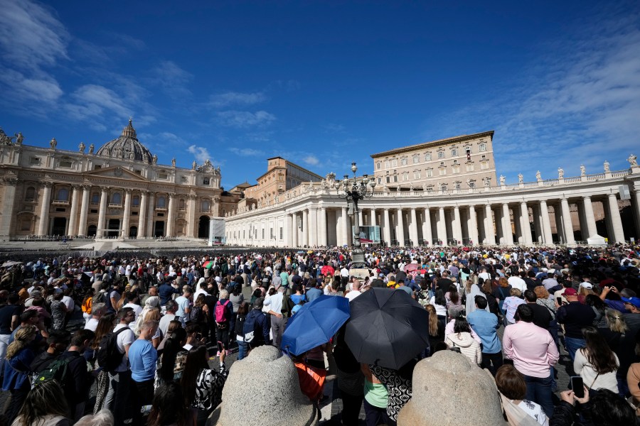 Pope Francis appears at his studio window for the traditional noon blessing of faithful and pilgrims gathered in St. Peter's Square at The Vatican, Sunday, Oct. 6, 2024. (AP Photo/Andrew Medichini)