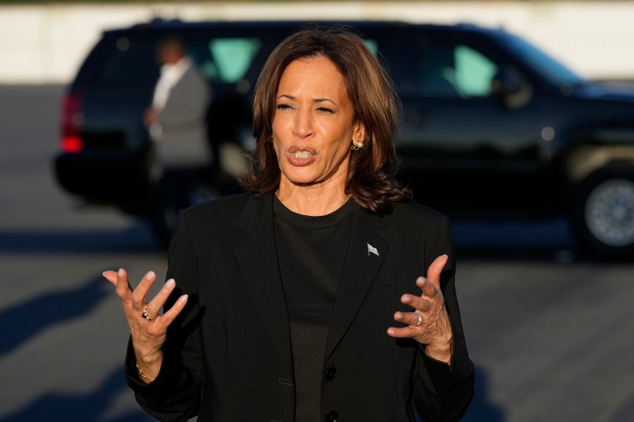 Democratic presidential nominee Vice President Kamala Harris speaks to reporters before boarding Air Force Two at Charlotte Douglas International Airport, Saturday, October 5, 2024, in Charlotte, N.C., after a briefing on the damage from Hurricane Helene. (AP Photo/Chris Carlson)