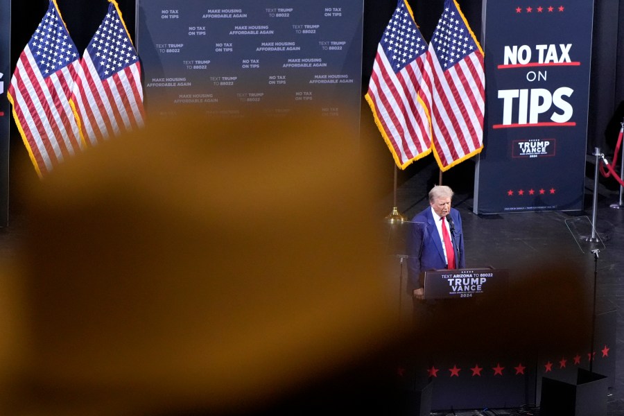 FILE - A supporter listens as Republican presidential nominee former President Donald Trump speaks during a campaign event, Sept.12, 2024, in Tucson, Ariz. (AP Photo/Alex Brandon, File)