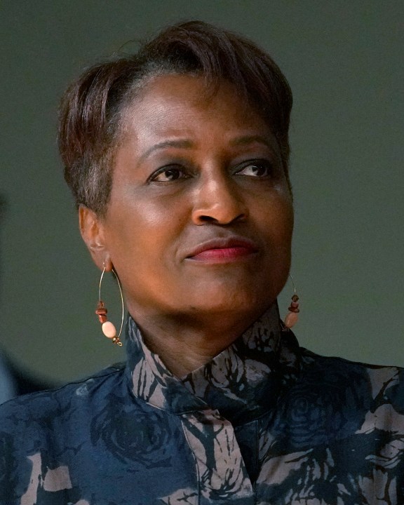 Mary Gardner, one of six nominees by Chicago Mayor Brandon Johnson to the Chicago Board of Education, listens to the mayor during a news conference introducing his nominees Monday, Oct. 7, 2024, in Chicago. (AP Photo/Charles Rex Arbogast)