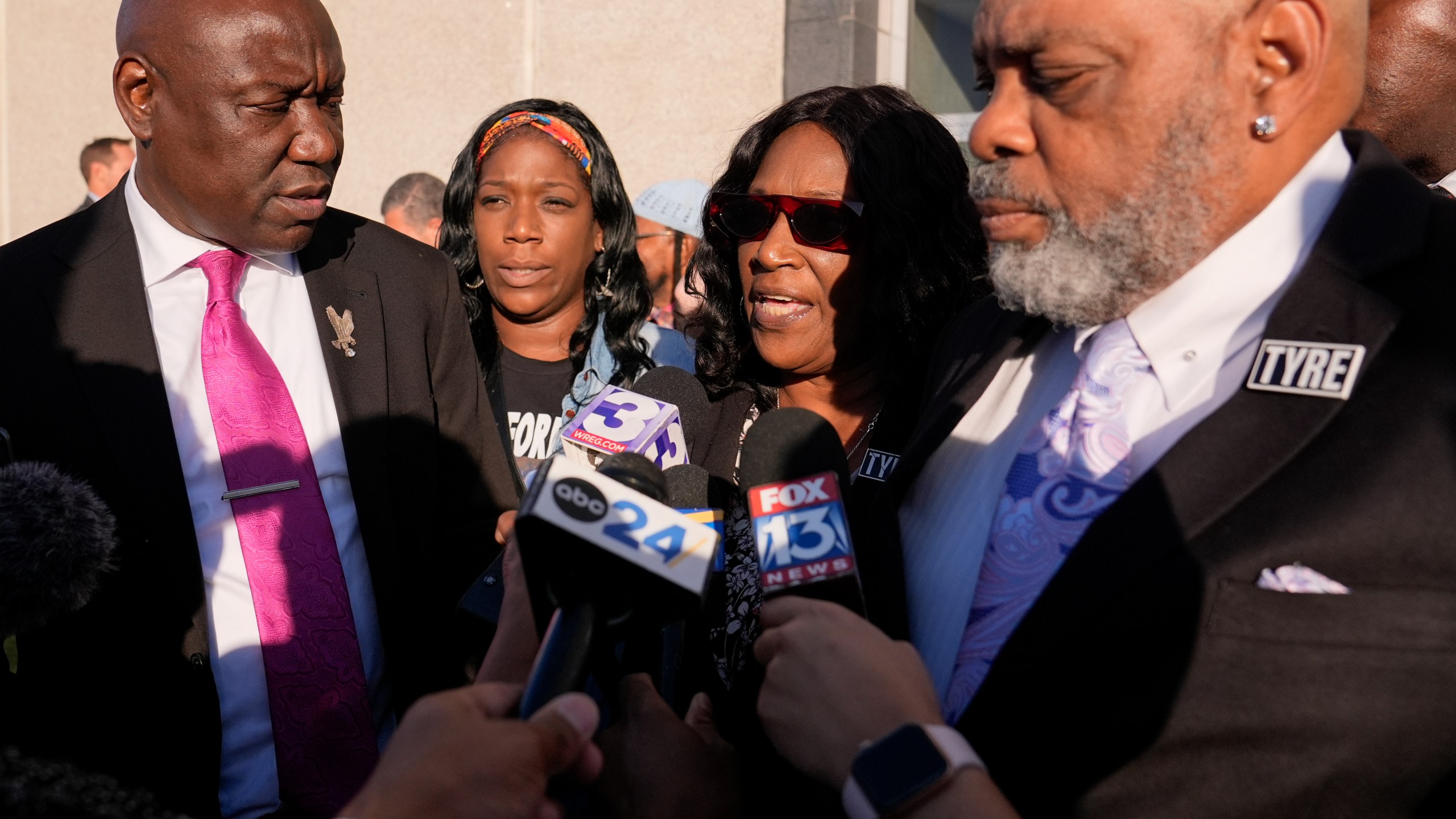 RowVaughn Wells, second from right, mother of Tyre Nichols, speaks during a news conference outside the federal courthouse after three former Memphis police officers were convicted of witness tampering charges in the 2023 fatal beating of Nichols, Thursday, Oct. 3, 2024, in Memphis, Tenn. (AP Photo/George Walker IV)