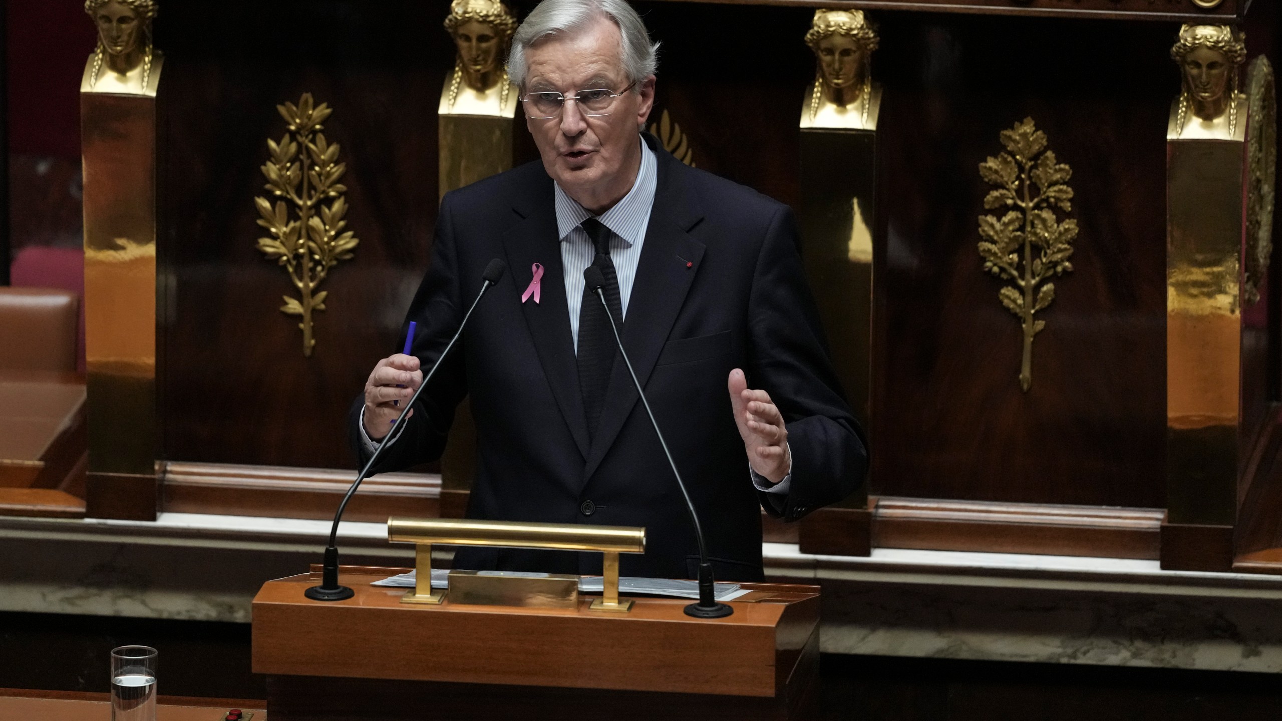 France's Prime Minister Michel Barnier gestures as delivers a speech at the National Assembly, in Paris, Tuesday, Oct. 1, 2024. (AP Photo/Thibault Camus)