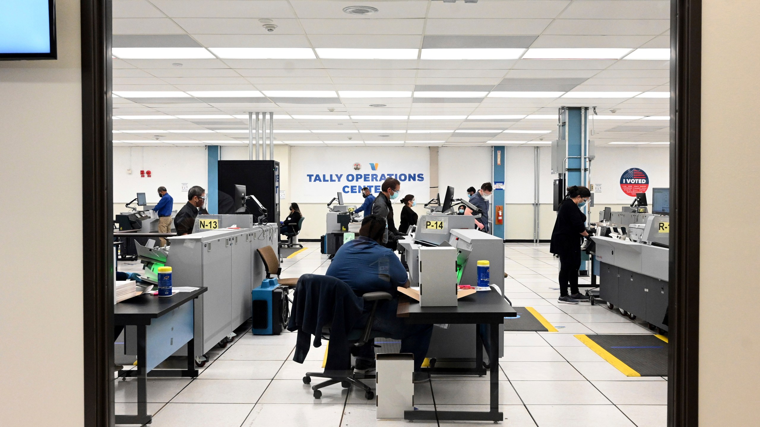 FILE - Workers count votes on election night at the Los Angeles County Registrar's Tally Operations Center in Downey, Calif., Tuesday, Nov. 3, 2020. (Keith Birmingham/The Orange County Register via AP, File)