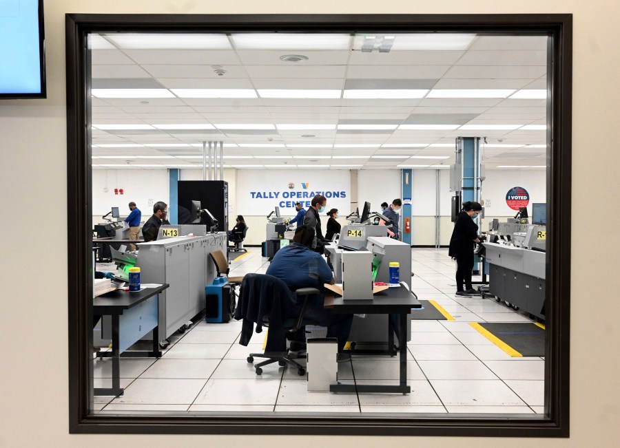 FILE - Workers count votes on election night at the Los Angeles County Registrar's Tally Operations Center in Downey, Calif., Tuesday, Nov. 3, 2020. (Keith Birmingham/The Orange County Register via AP, File)