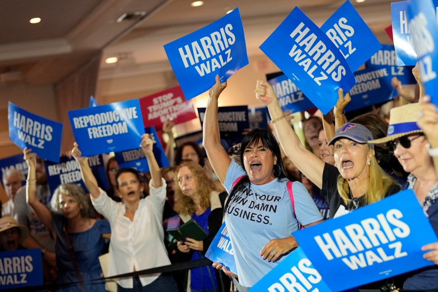 FILE - Supporters cheer as speakers arrive at an event kicking off a national "Reproductive Freedom Bus Tour" by the campaign of Democratic presidential nominee Vice President Kamala Harris and running mate Gov. Tim Walz, Sept. 3, 2024, in Boynton Beach, Fla. (AP Photo/Rebecca Blackwell, File)