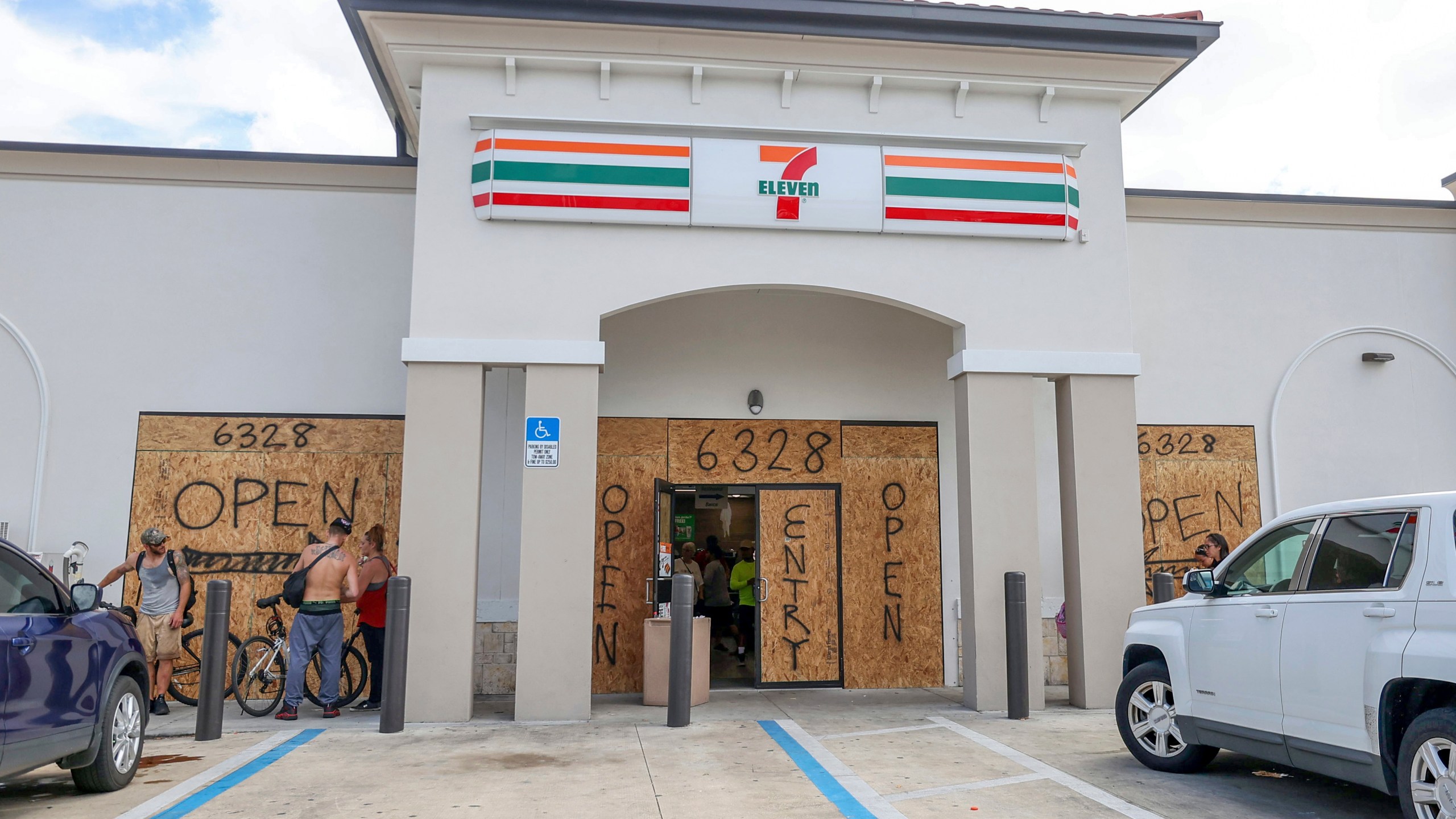 A store boards up but remains open in preparation for Hurricane Milton on Tuesday, Oct. 8, 2024, in New Port Richey, Fla. (AP Photo/Mike Carlson)