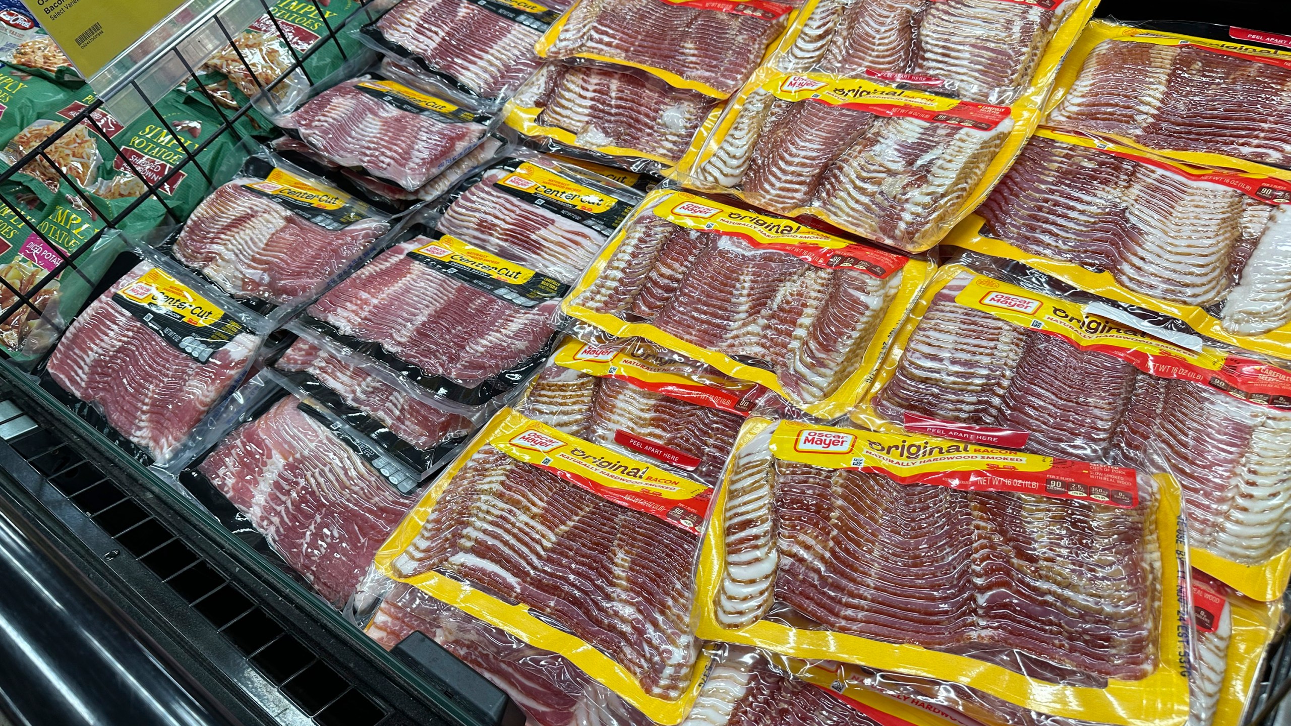 Oscar Mayer bacon packages are on display in a refrigerated case in a King Soopers grocery store Monday, Oct. 7, 2024, in southeast Denver. (AP Photo/David Zalubowski)