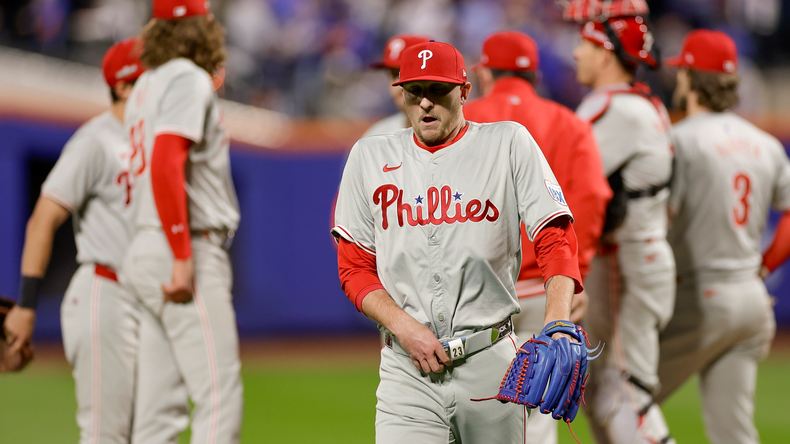 Philadelphia Phillies pitcher Jeff Hoffman walks off the field after walking the bases loaded against the New York Mets during the sixth inning of Game 4 of the National League baseball playoff series, Wednesday, Oct. 9, 2024, in New York. (AP Photo/Adam Hunger)