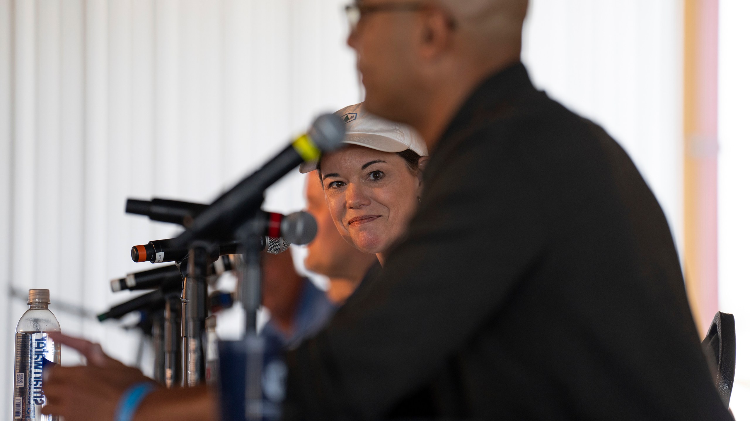 FILE - Rep. Angie Craig listens as candidate Joe Teirab speaks during a Congressional candidate forum for Minnesota's first and second districts at Farmfest in Morgan, Minn., Tuesday, Aug. 6, 2024. (Shari L. Gross/Star Tribune via AP, File)