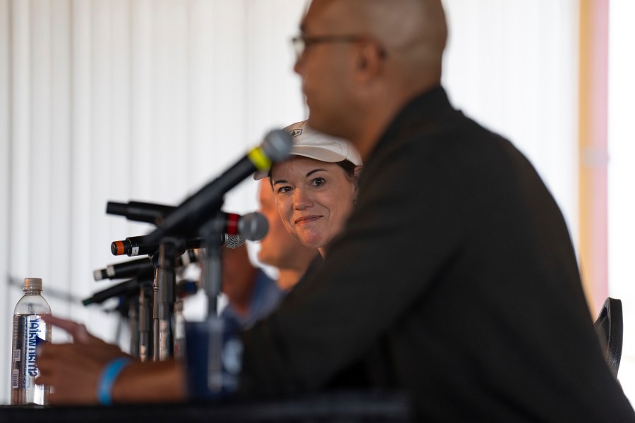 FILE - Rep. Angie Craig listens as candidate Joe Teirab speaks during a Congressional candidate forum for Minnesota's first and second districts at Farmfest in Morgan, Minn., Tuesday, Aug. 6, 2024. (Shari L. Gross/Star Tribune via AP, File)