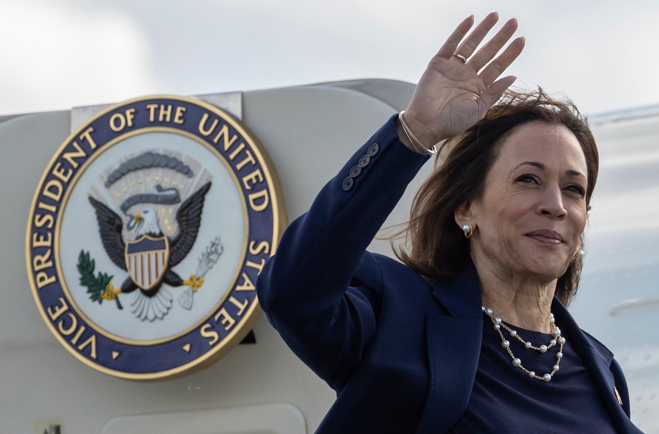 Democratic presidential nominee Vice President Kamala Harris waves as she boards Air Force Two at LaGuardia International Airport, Wednesday, Oct. 9, 2024, in New York. (AP Photo/Yuki Iwamura)