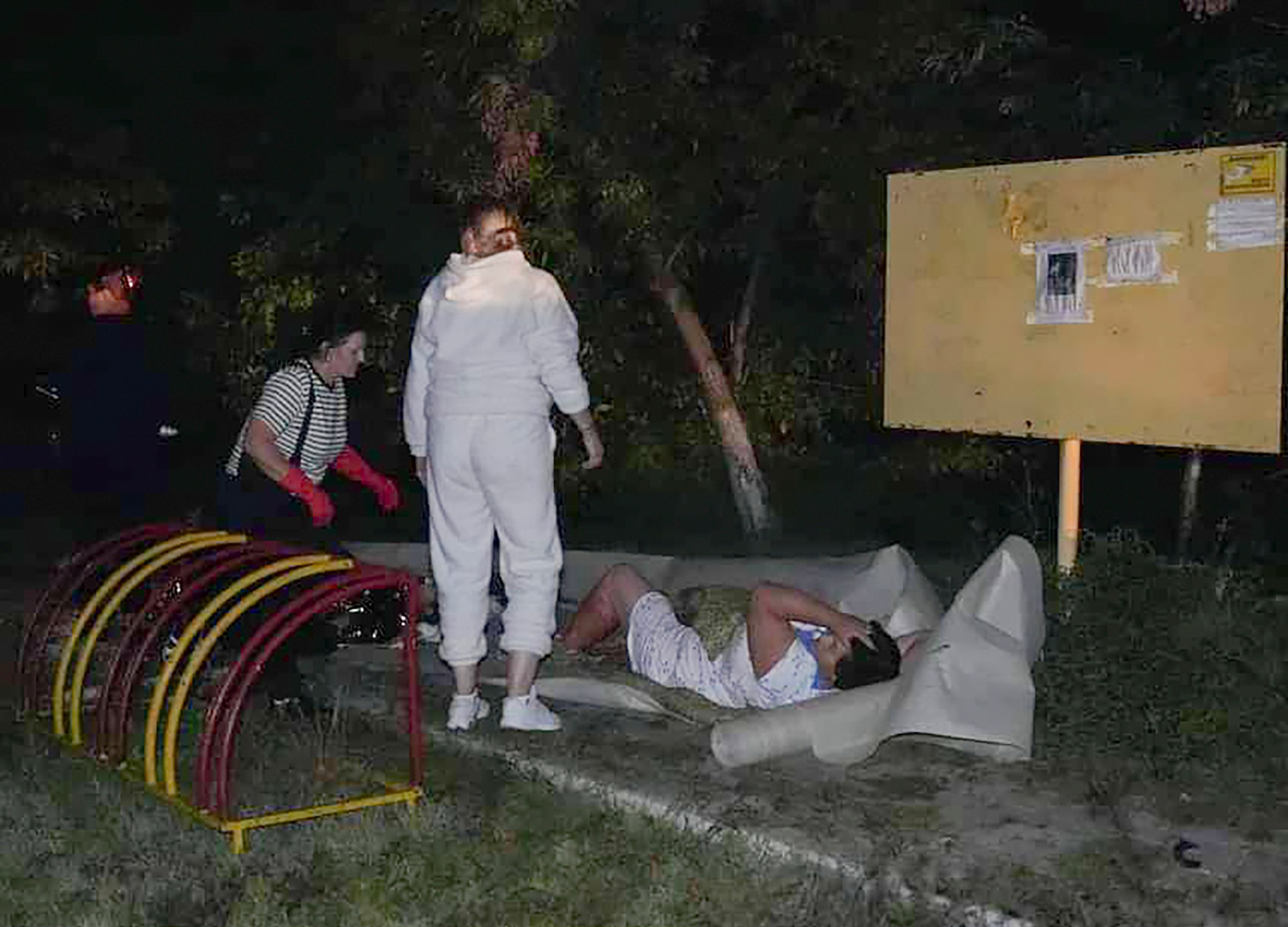 In this photo provided by the Ukrainian Emergency Service, Emergency workers provide first aid to a wounded resident after a Russian missile attack that killed four, injured ten in Odesa, Ukraine, late Thursday, Oct. 10, 2024. (Ukrainian Emergency Service via AP)