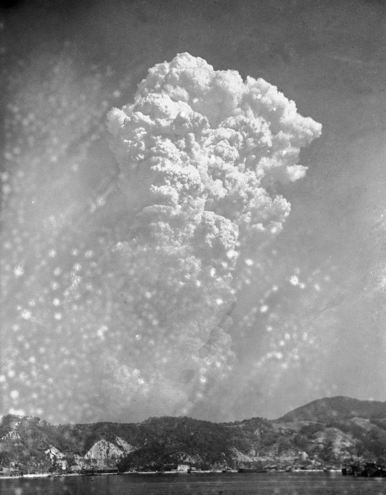 FILE - Smoke rises around 20,000 feet above Hiroshima, Japan, after the first atomic bomb was dropped, Aug. 6, 1945. The Nobel Peace Prize has been awarded to Nihon Hidankyo, a Japanese organization of survivors of the U.S. atomic bombings of Hiroshima and Nagasaki, for its activism against nuclear weapons. (AP Photo, File)