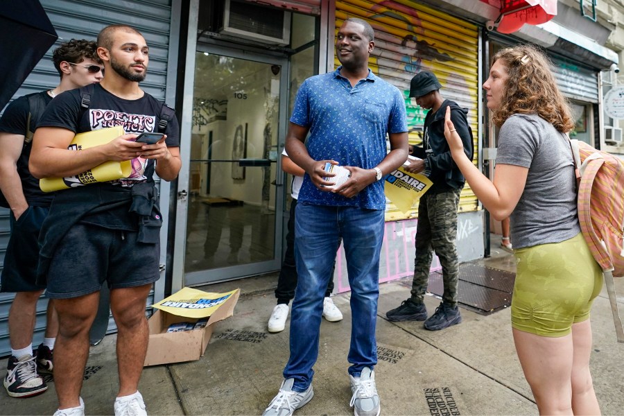 FILE — U.S. Rep. Mondaire Jones, D-NY, center, talks to campaign volunteers and staff during a canvass kick-off on the Lower East Side of Manhattan, Aug. 22, 2022, in New York. (AP Photo/Mary Altaffer, File)