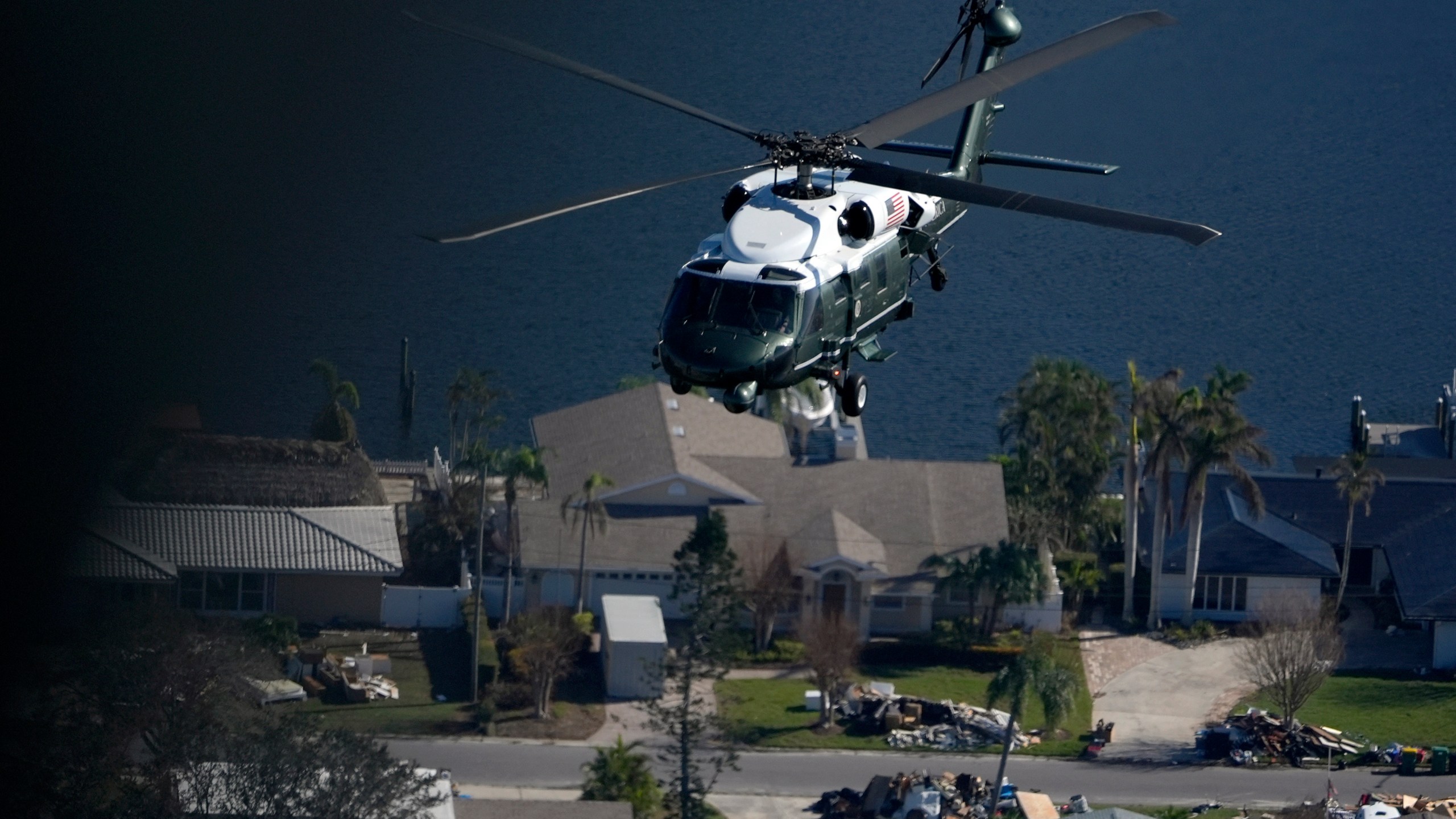 With President Joe Biden aboard, Marine One surveys areas affected by Hurricane Milton in Florida, from Tampa to St. Petersburg, Sunday, Oct. 13, 2024. (AP Photo/Manuel Balce Ceneta)