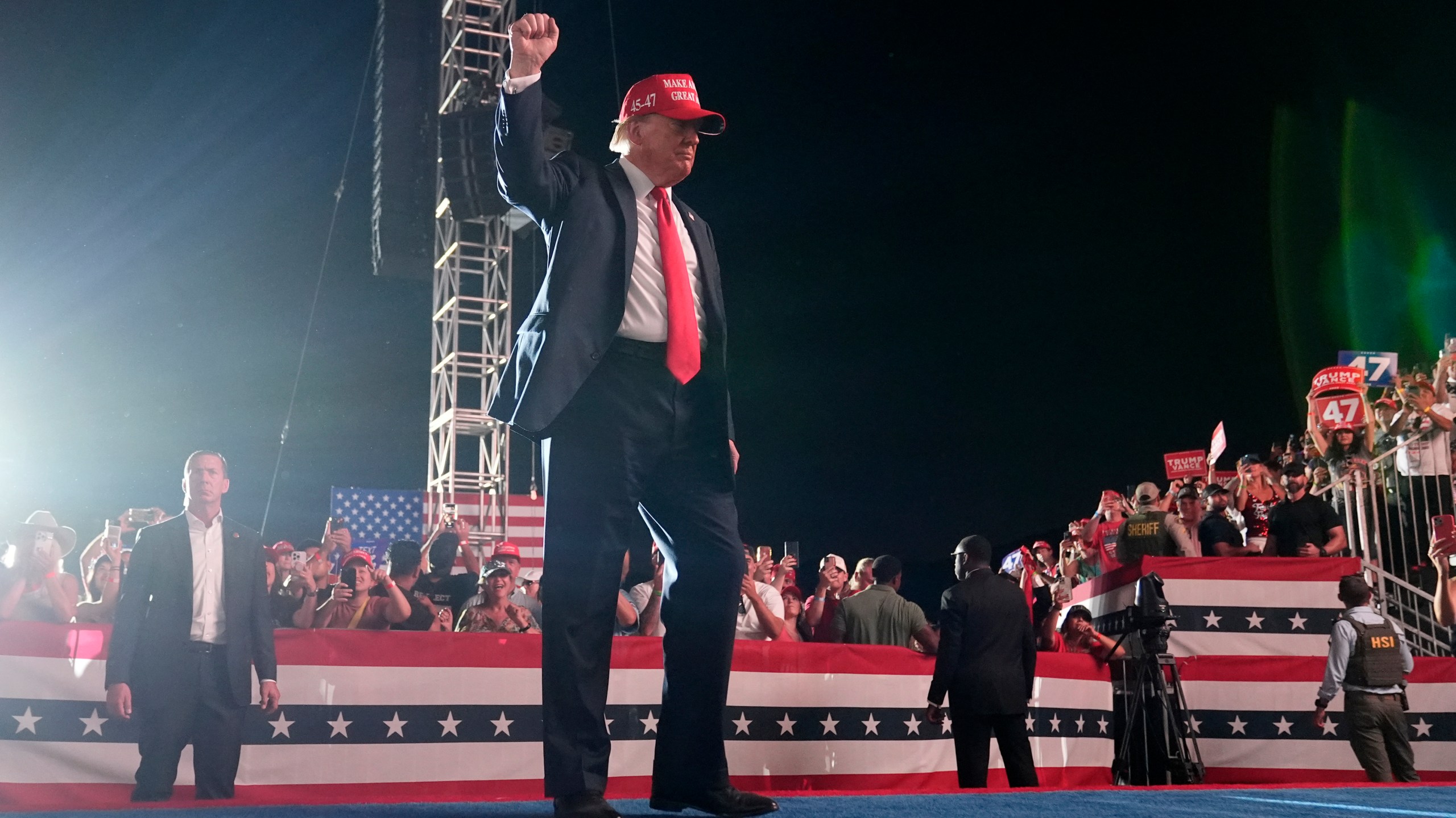 Republican presidential nominee former President Donald Trump gestures to the audience as he departs a campaign rally at the Calhoun Ranch, Saturday, Oct. 12, 2024, in Coachella, Calif. (AP Photo/Alex Brandon)