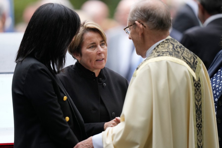 Massachusetts Gov. Maura Healey, center, speaks with Monsignor Kenneth Velo, right, following funeral services for Ethel Kennedy, wife of the late Sen. Robert F. Kennedy, at Our Lady of Victory church, Monday, Oct. 14, 2024, in Centerville, Mass. (AP Photo/Steven Senne)