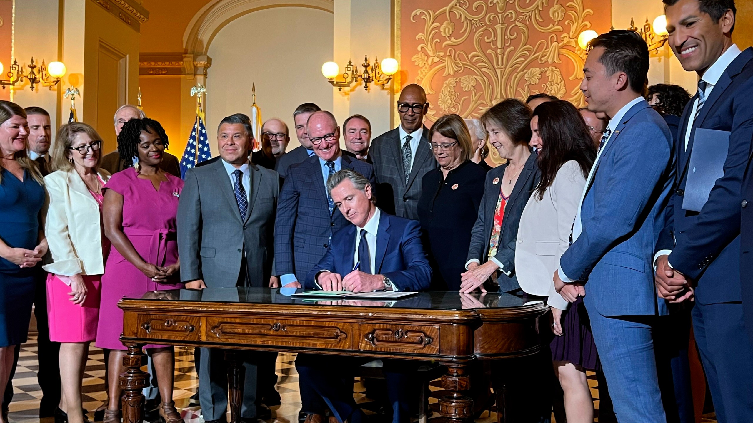 California Gov. Gavin Newsom signs legislation at the state Capitol on Monday, Oct. 14, 2024, aimed at preventing gas prices from spiking at the pump. (AP Photo/Sophie Austin)