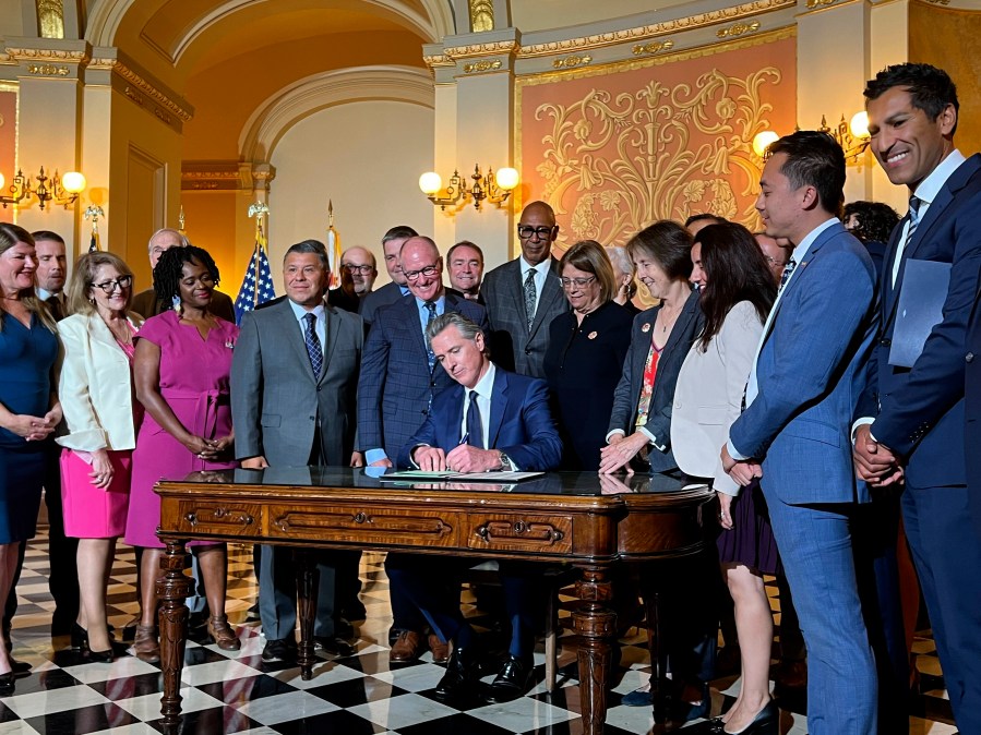 California Gov. Gavin Newsom signs legislation at the state Capitol on Monday, Oct. 14, 2024, aimed at preventing gas prices from spiking at the pump. (AP Photo/Sophie Austin)