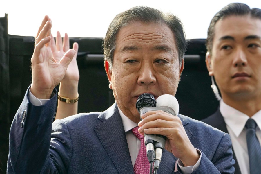 Yoshihiko Noda, leader of Japan's opposition Constitutional Democratic Party delivers a speech in Hachioji, outskirts of Tokyo as official campaigning for a parliamentary election later this month officially kicked off Tuesday, Oct. 15, 2024. (Kyodo News via AP)