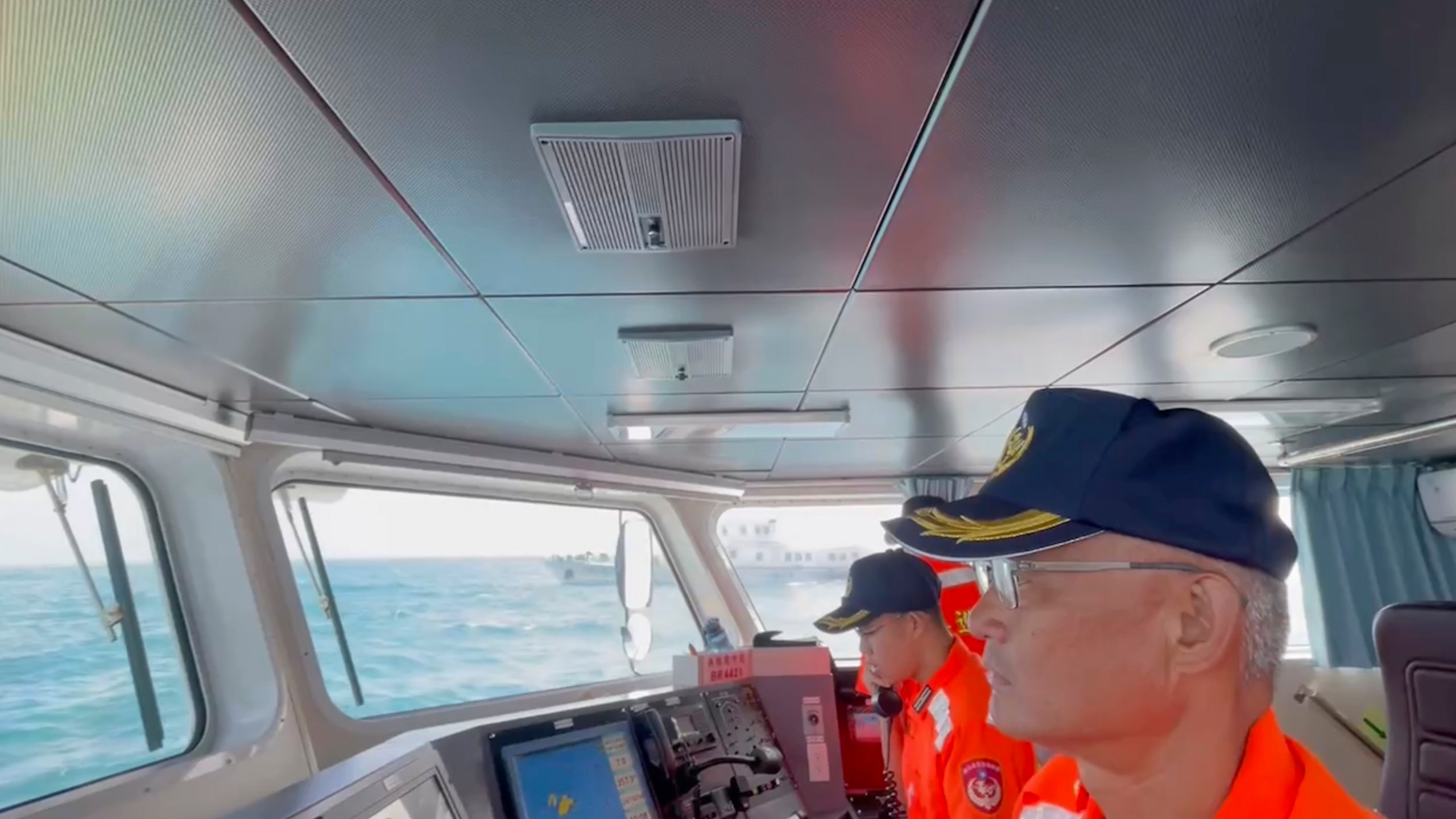 In this screen grab from video released by the Taiwan Coast Guard, Taiwan Coast Guard members track China's Coast Guard boat as it past near the coast of Matsu islands, Taiwan on Monday, Oct. 14, 2024. (Taiwan Coast Guard via AP)