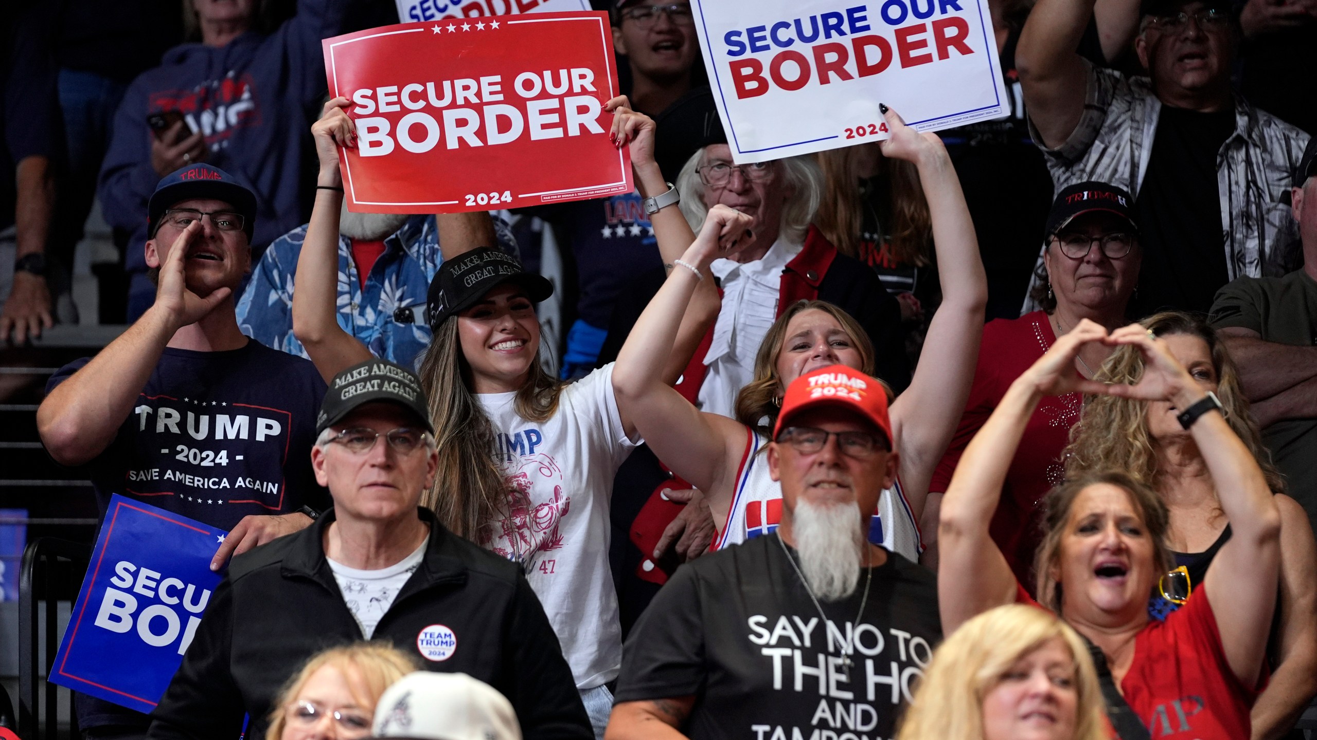 Supports react as Republican presidential nominee former President Donald Trump speaks at a campaign rally at the Findlay Toyota Arena Sunday, Oct. 13, 2024, in Prescott Valley, Ariz. (AP Photo/Evan Vucci)